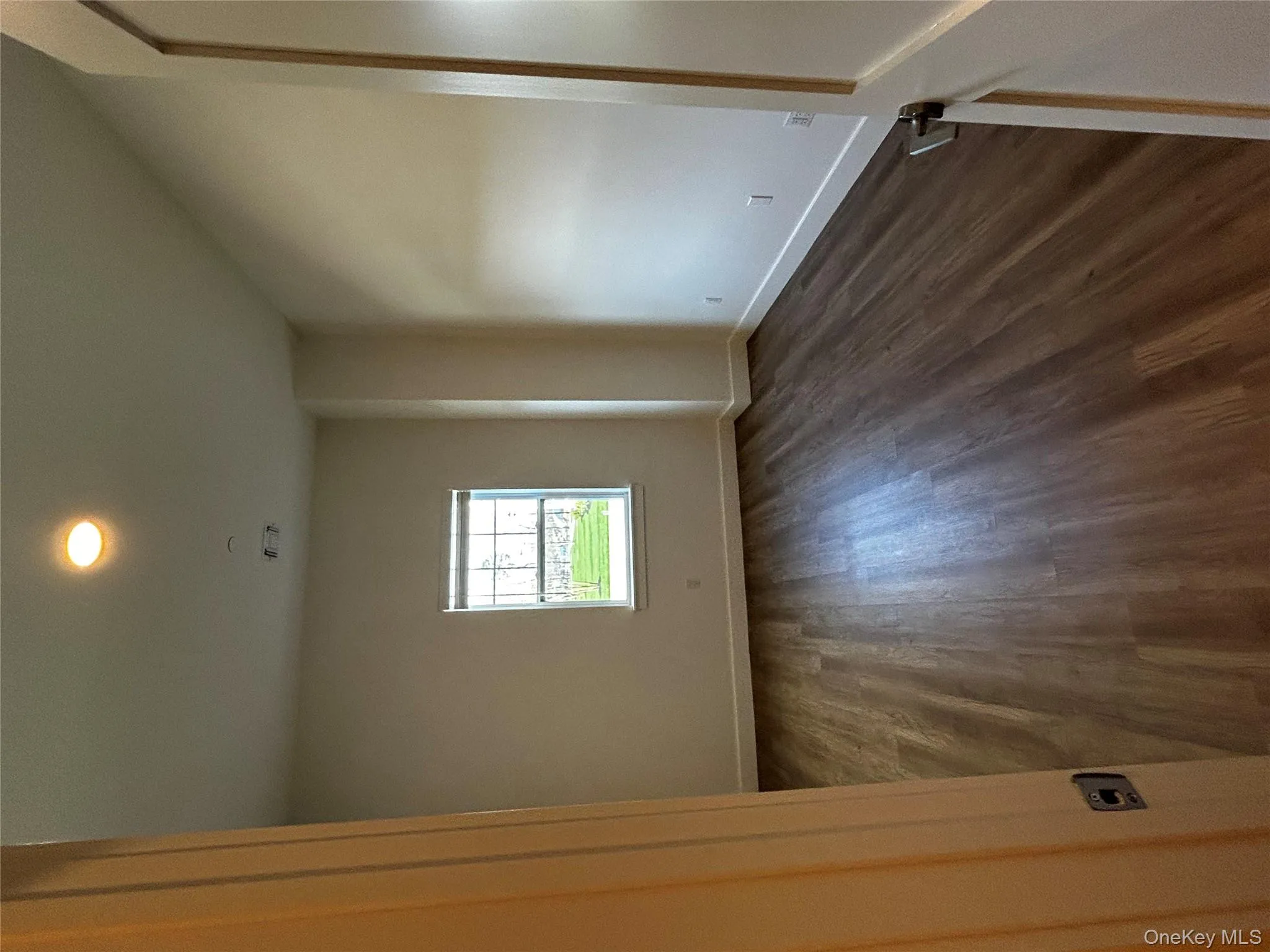 Unfurnished room featuring baseboards, recessed lighting, dark wood-style floors, and visible vents Unfurnished room featuring baseboards, recessed lighting, dark wood-style floors, and visible vents