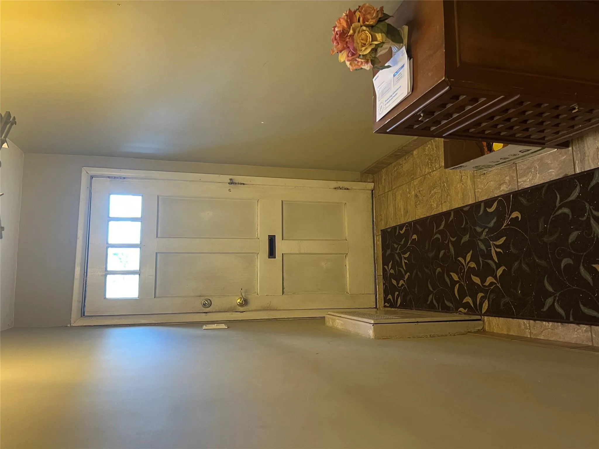 Doorway featuring baseboards and radiator Doorway featuring baseboards and radiator