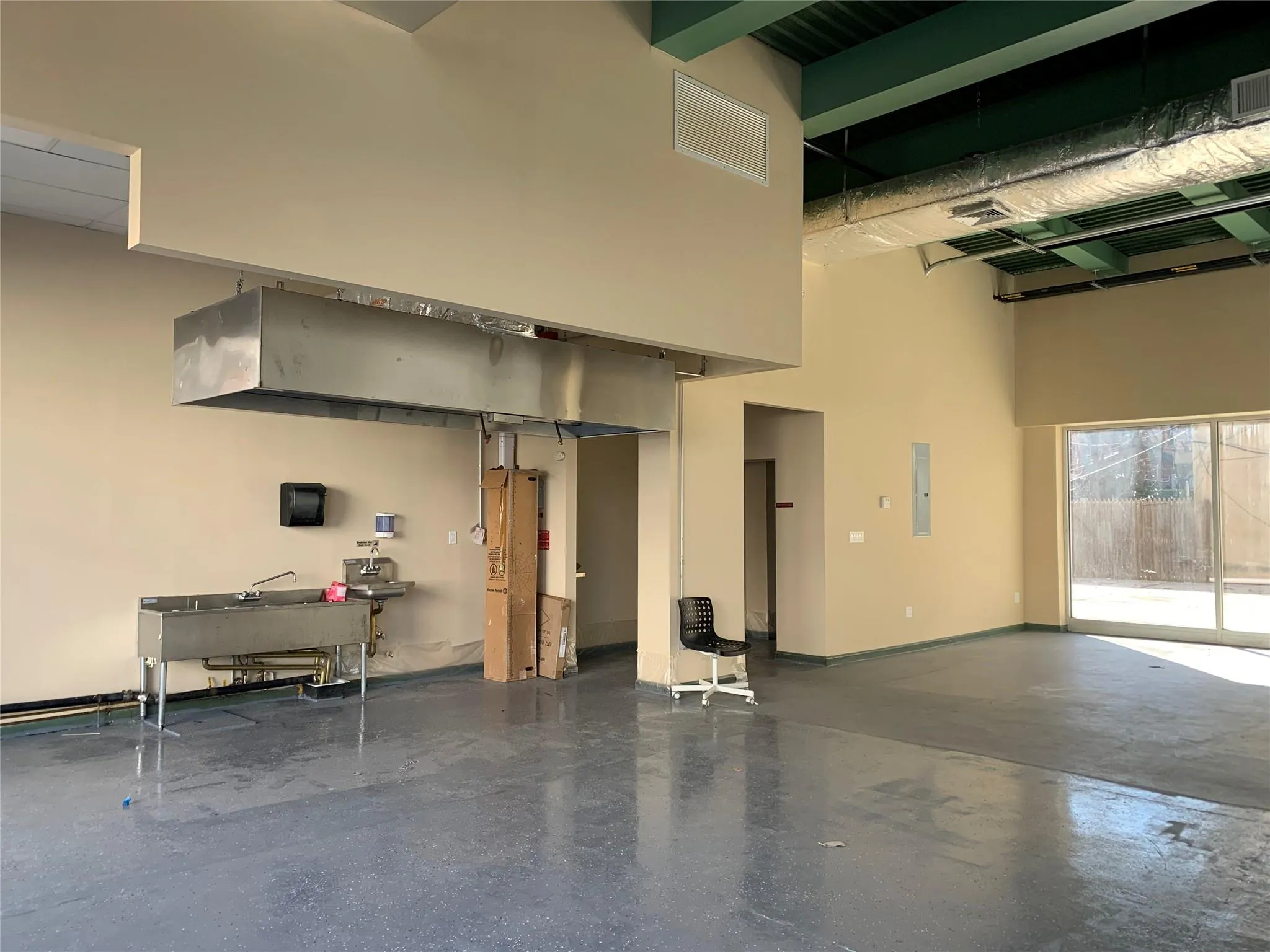 Garage with visible vents and electric panel Garage with visible vents and electric panel