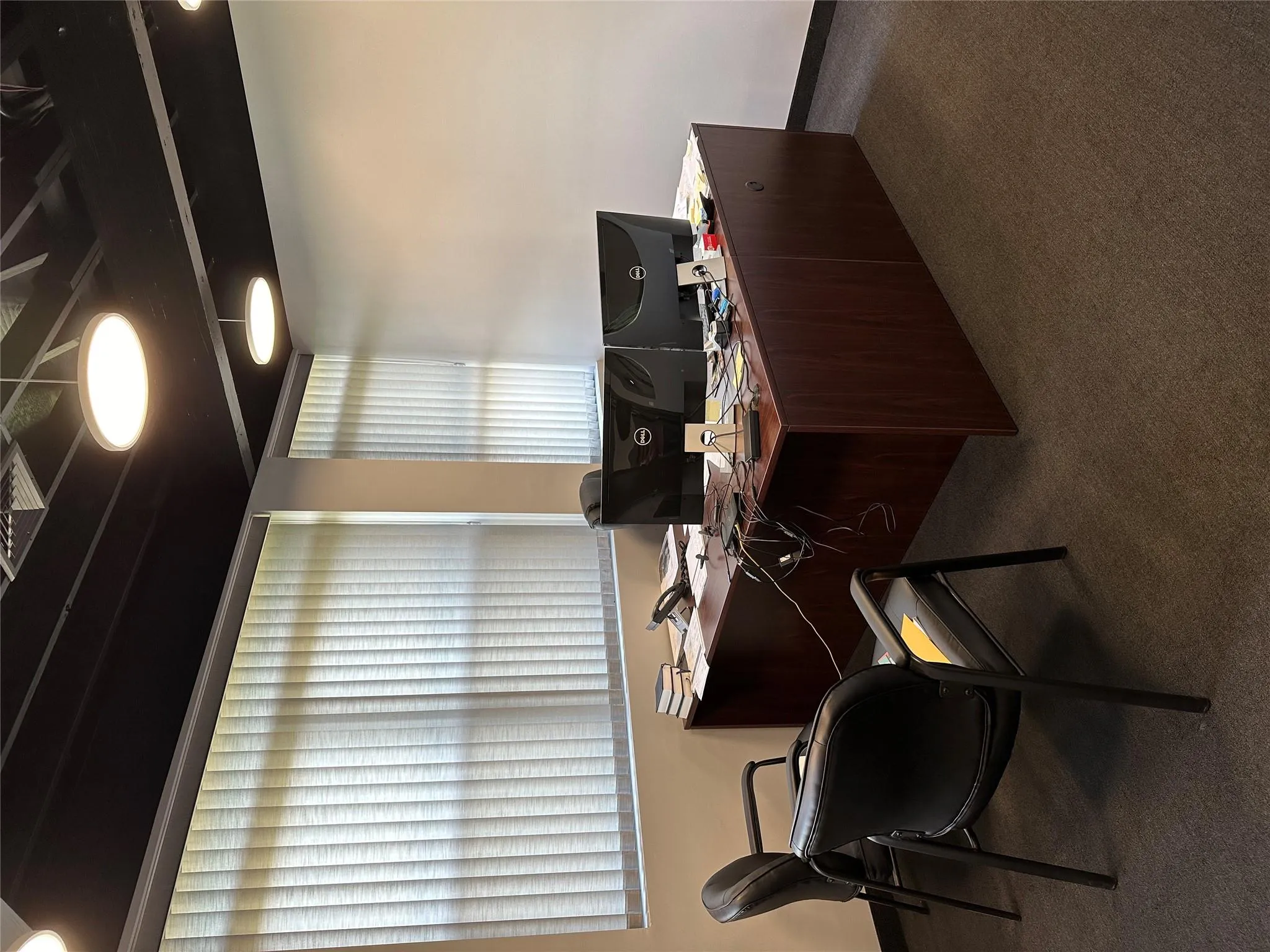 Home office with carpet floors and baseboards Home office with carpet floors and baseboards