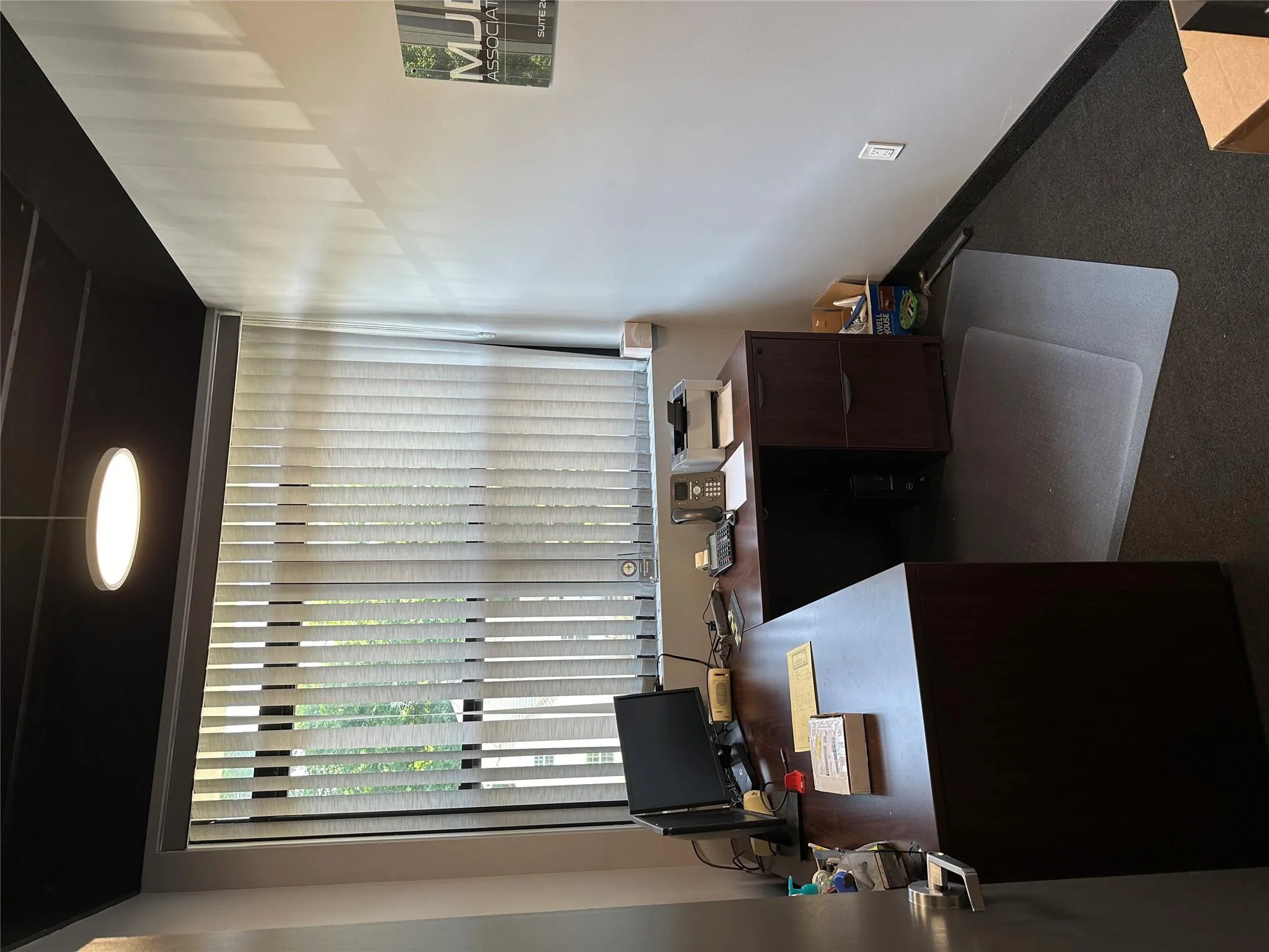 Carpeted office with baseboards Carpeted office with baseboards