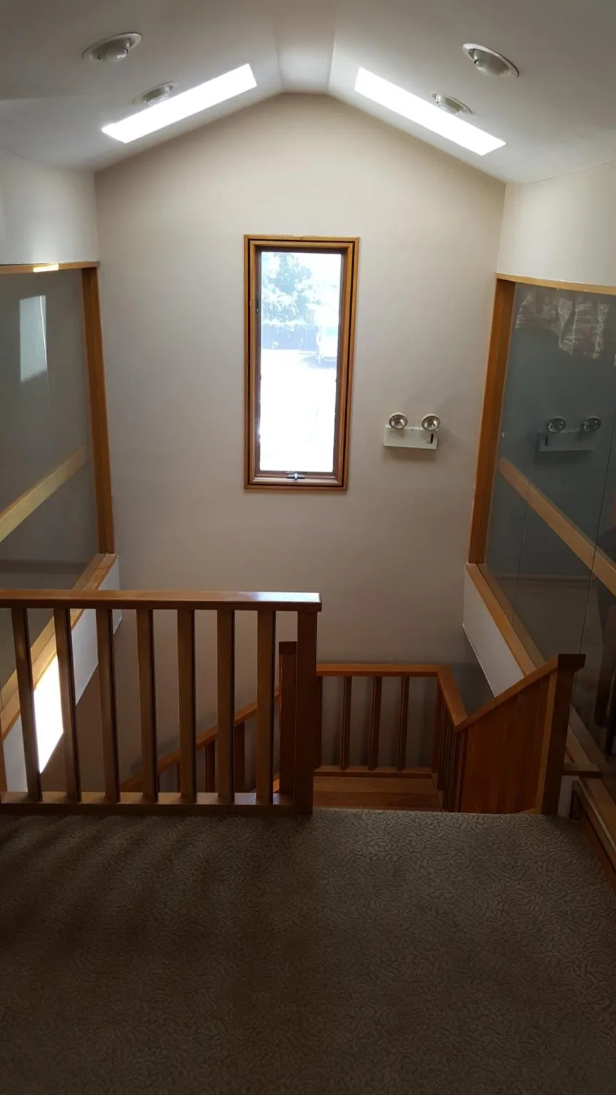 Stairs featuring carpet flooring and lofted ceiling Stairs featuring carpet flooring and lofted ceiling