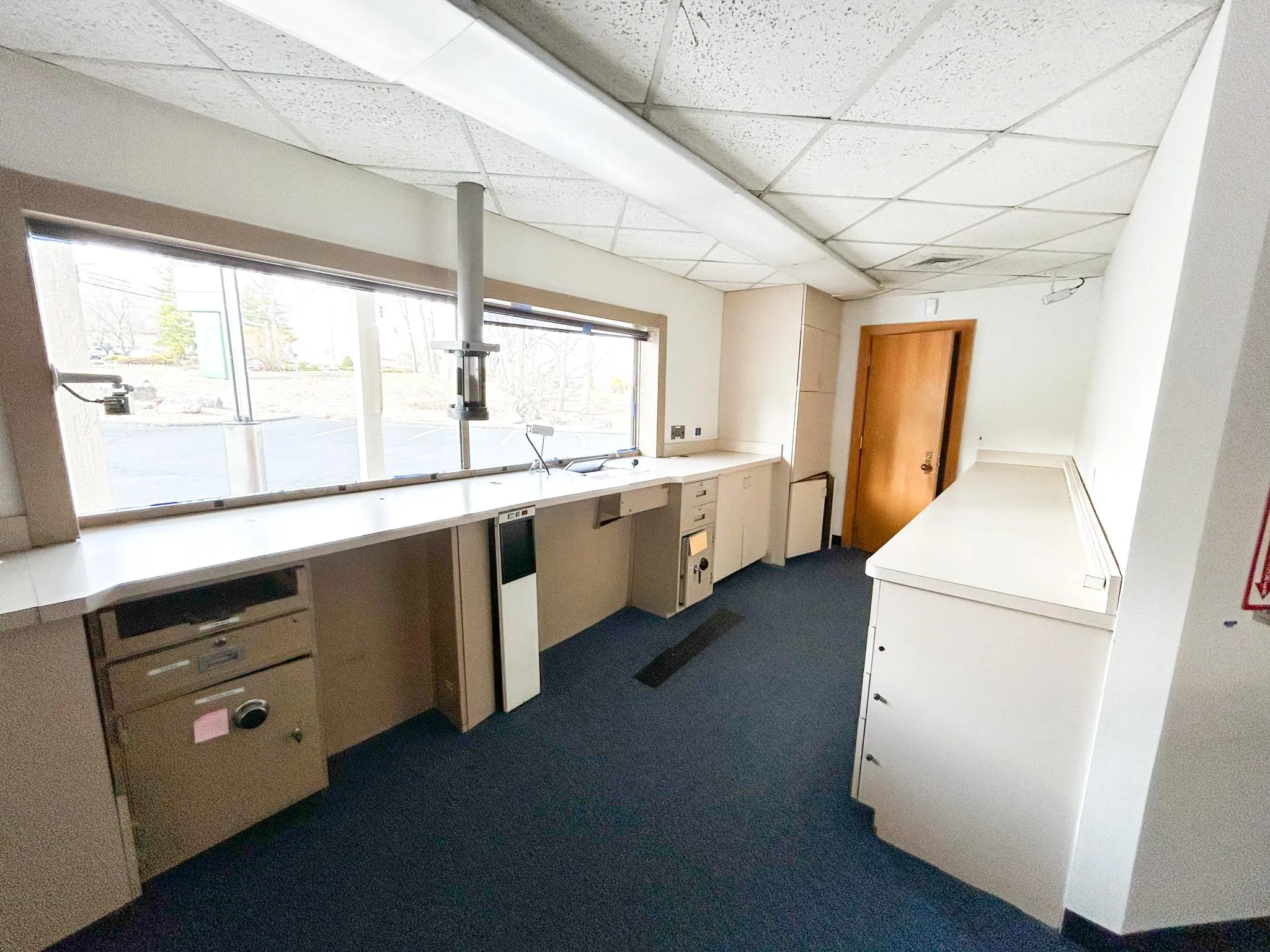 Washroom with a healthy amount of sunlight and dark colored carpet Washroom with a healthy amount of sunlight and dark colored carpet