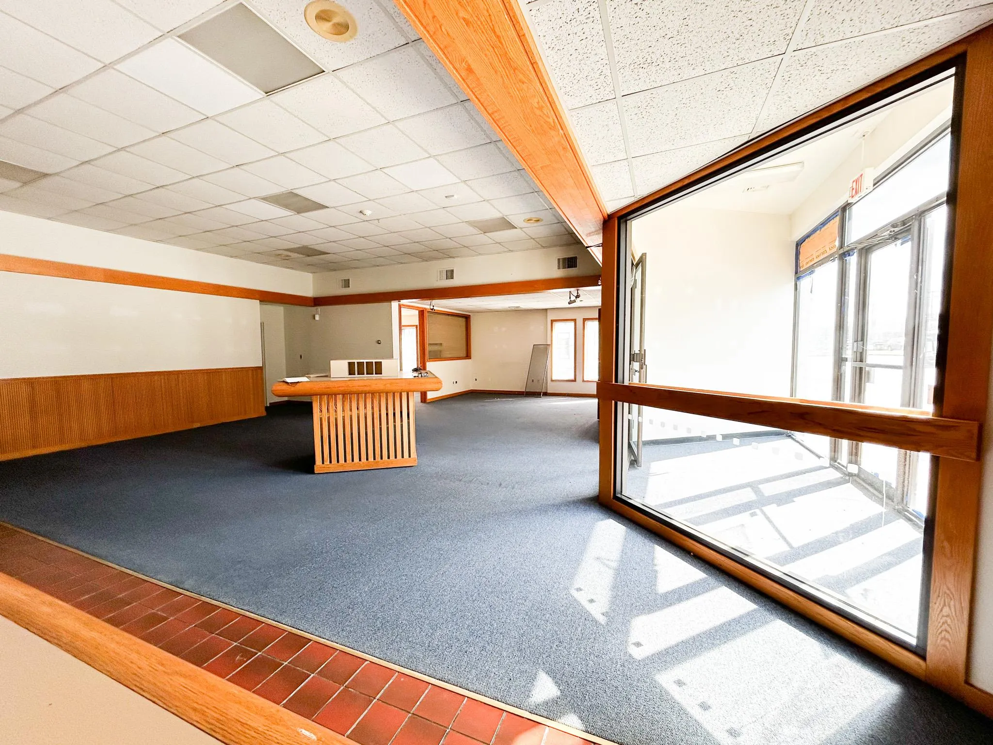 Bar with wood walls, wainscoting, visible vents, and a paneled ceiling Bar with wood walls, wainscoting, visible vents, and a paneled ceiling