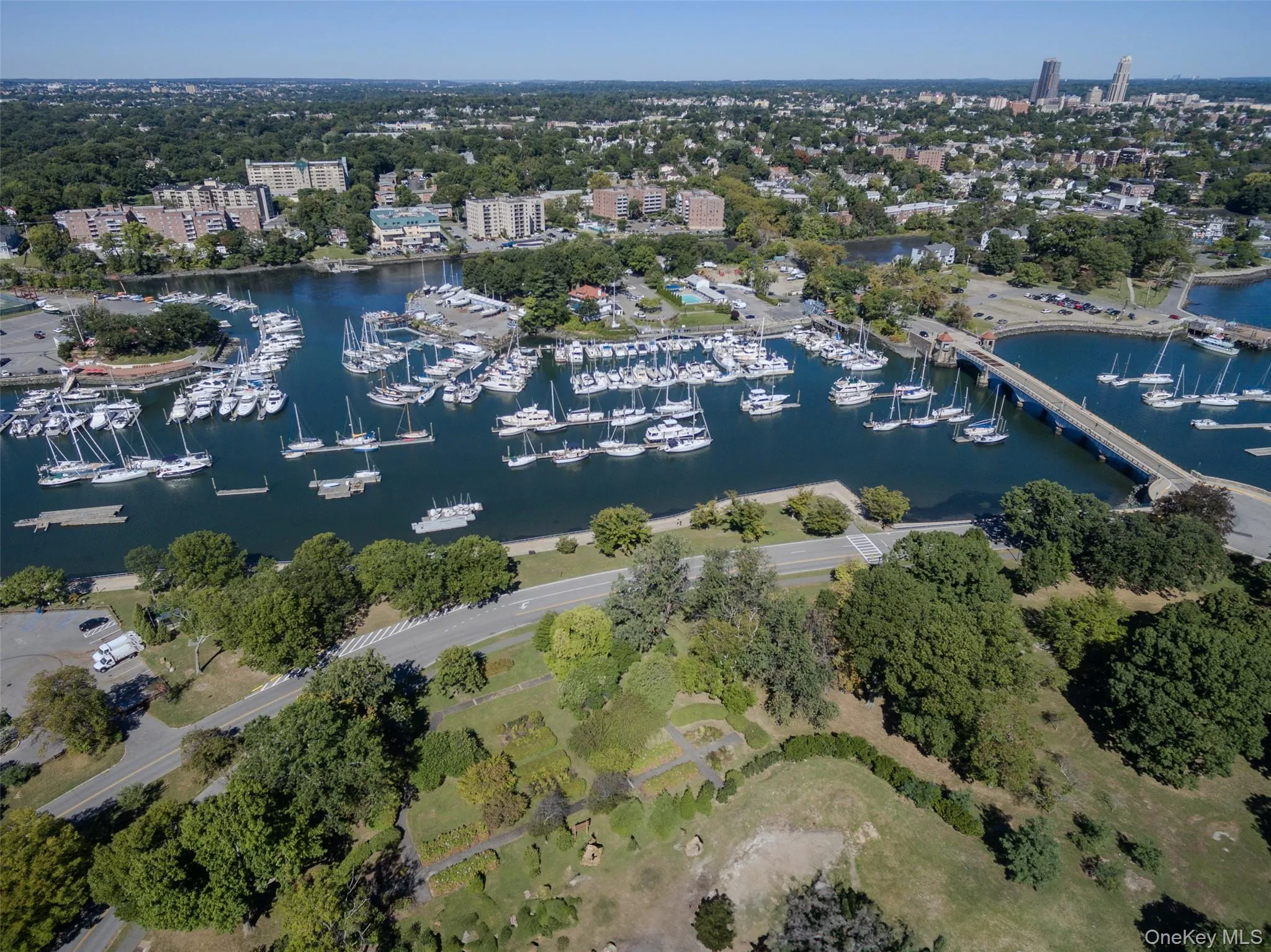 Aerial view of property's location with numerous boat docks and a large body of water Aerial view of property's location with numerous boat docks and a large body of water