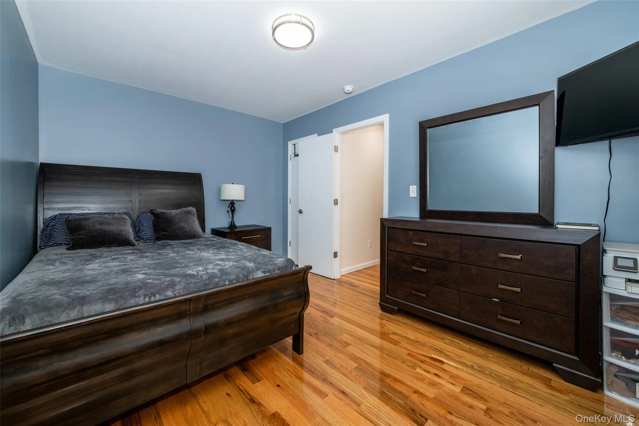 Bedroom with light wood-style flooring Bedroom with light wood-style flooring