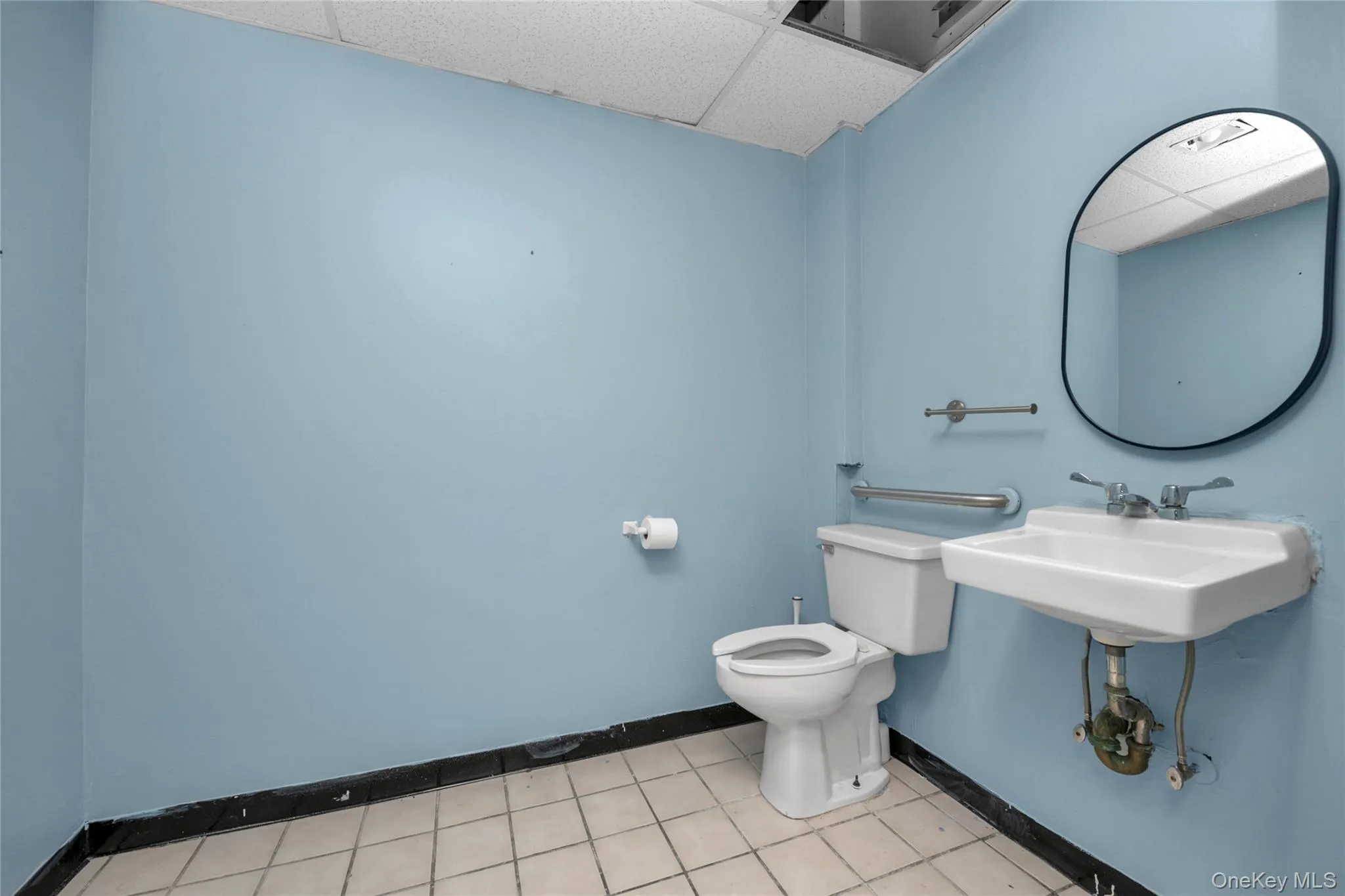 Bathroom featuring a paneled ceiling Bathroom featuring a paneled ceiling