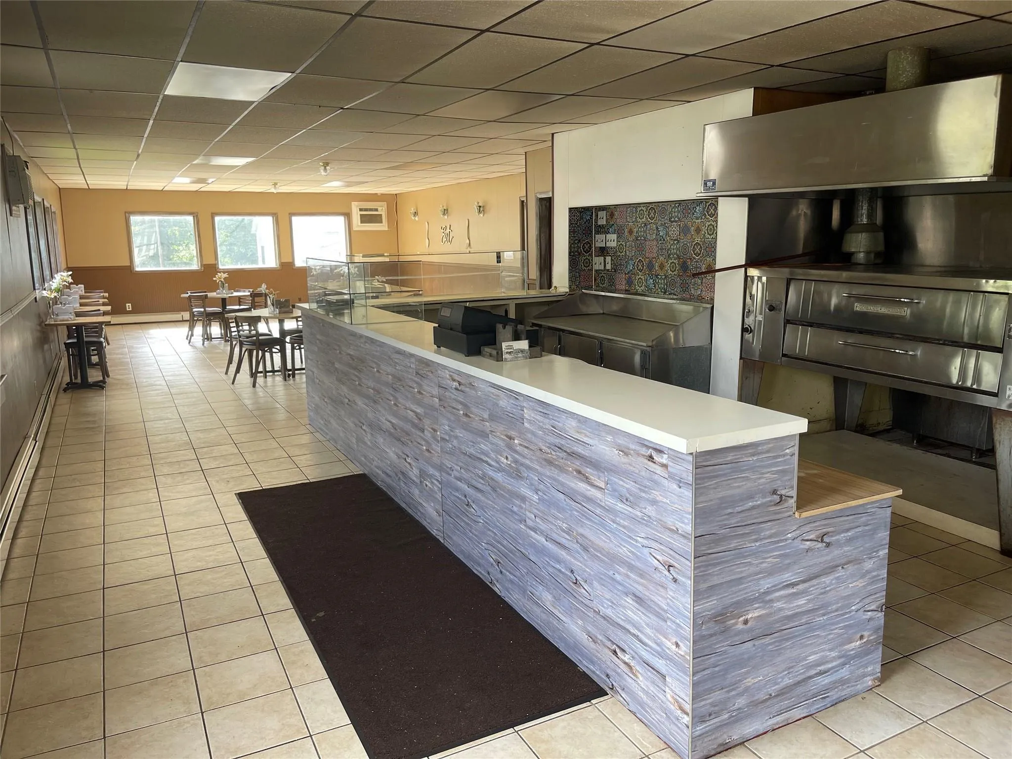 Kitchen with tile patterned floors and a drop ceiling Kitchen with tile patterned floors and a drop ceiling