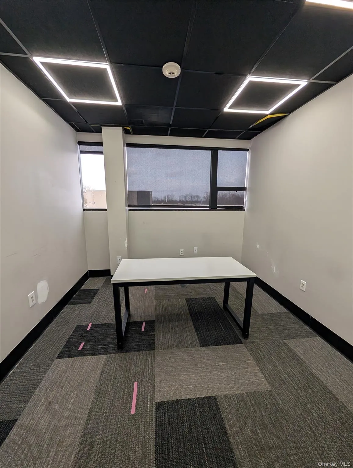 Unfurnished office featuring a drop ceiling Unfurnished office featuring a drop ceiling