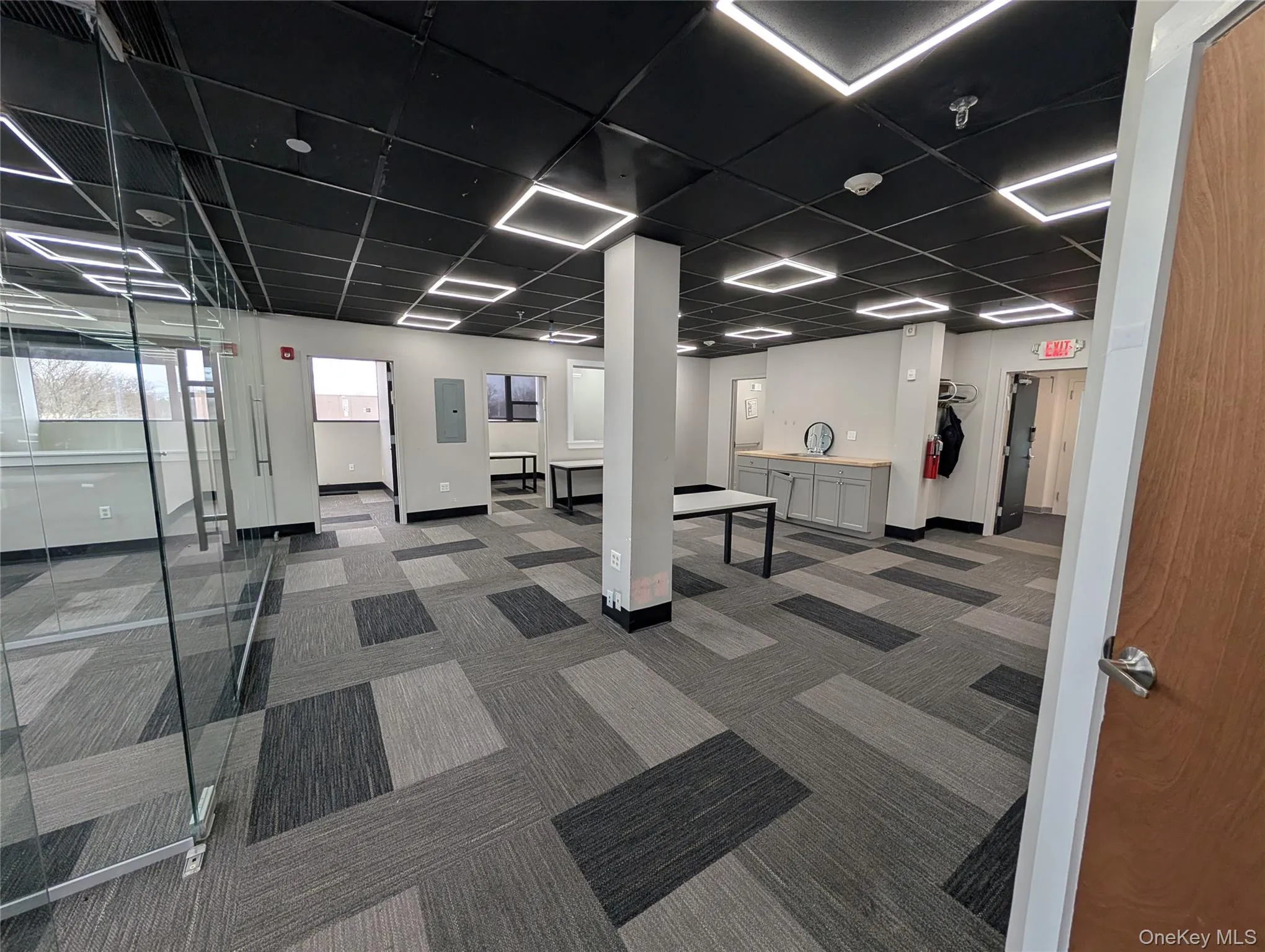 Building lobby featuring electric panel Building lobby featuring electric panel