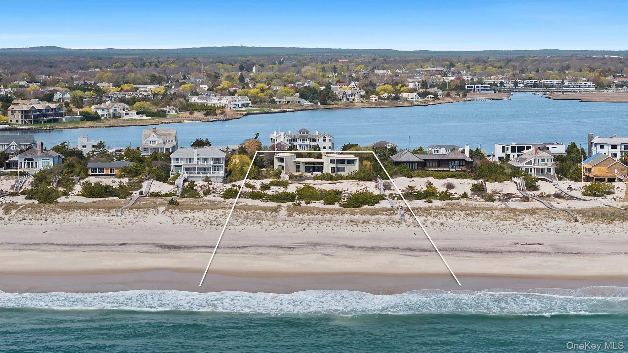 Aerial view featuring a water view and a beach view
