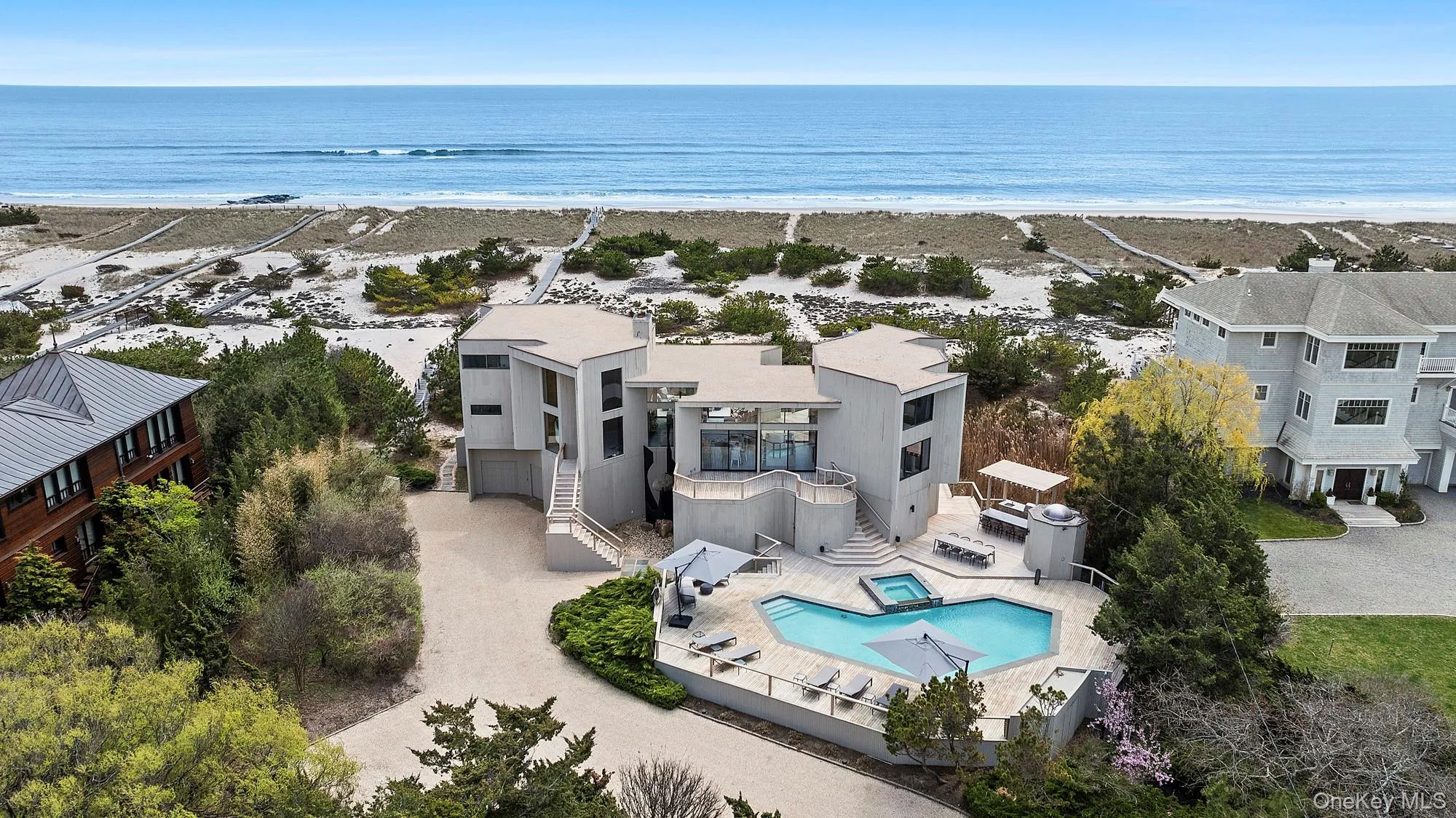 Bird's eye view with a water view and a view of the beach