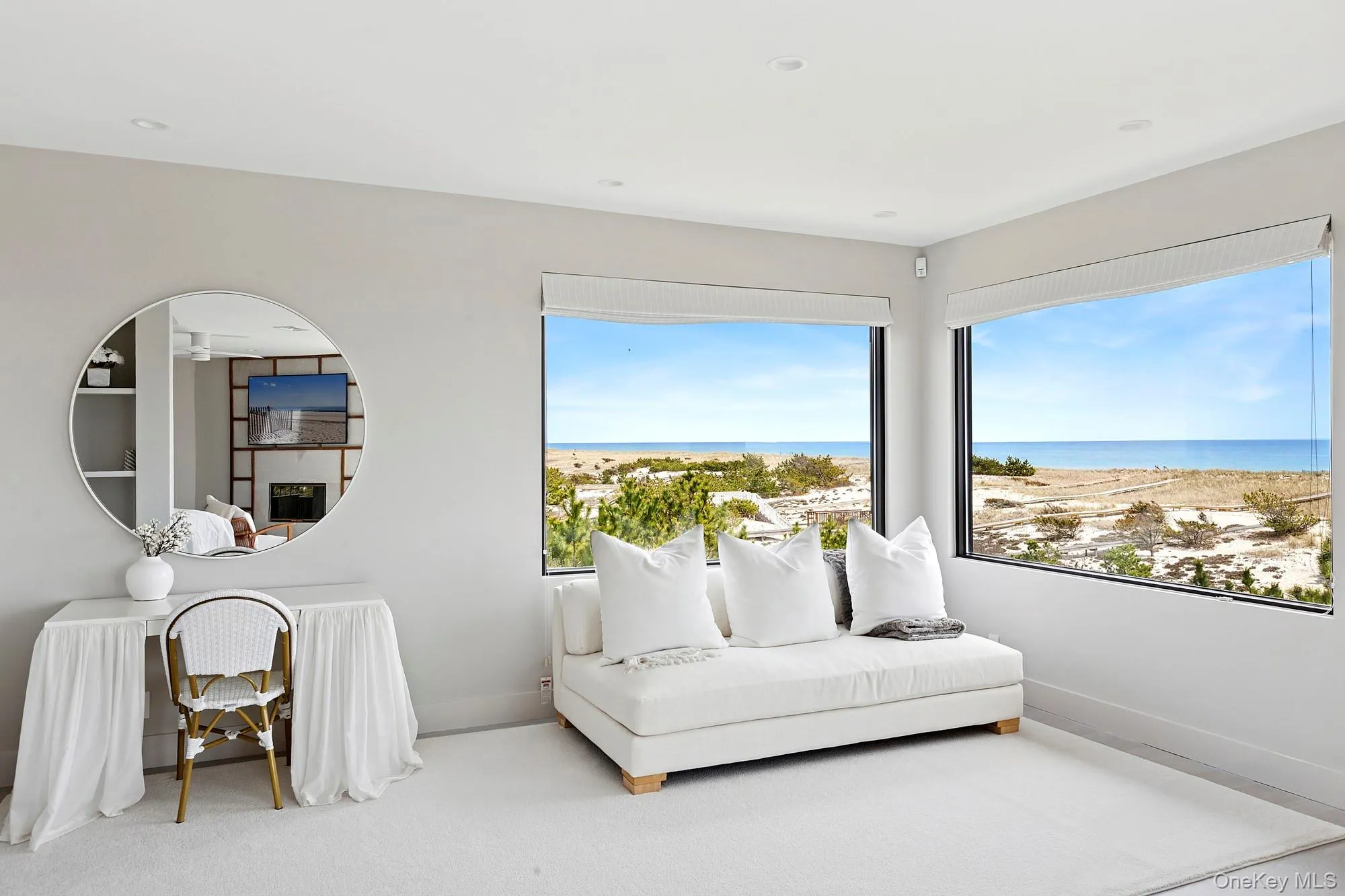 Living area featuring a water view and baseboards