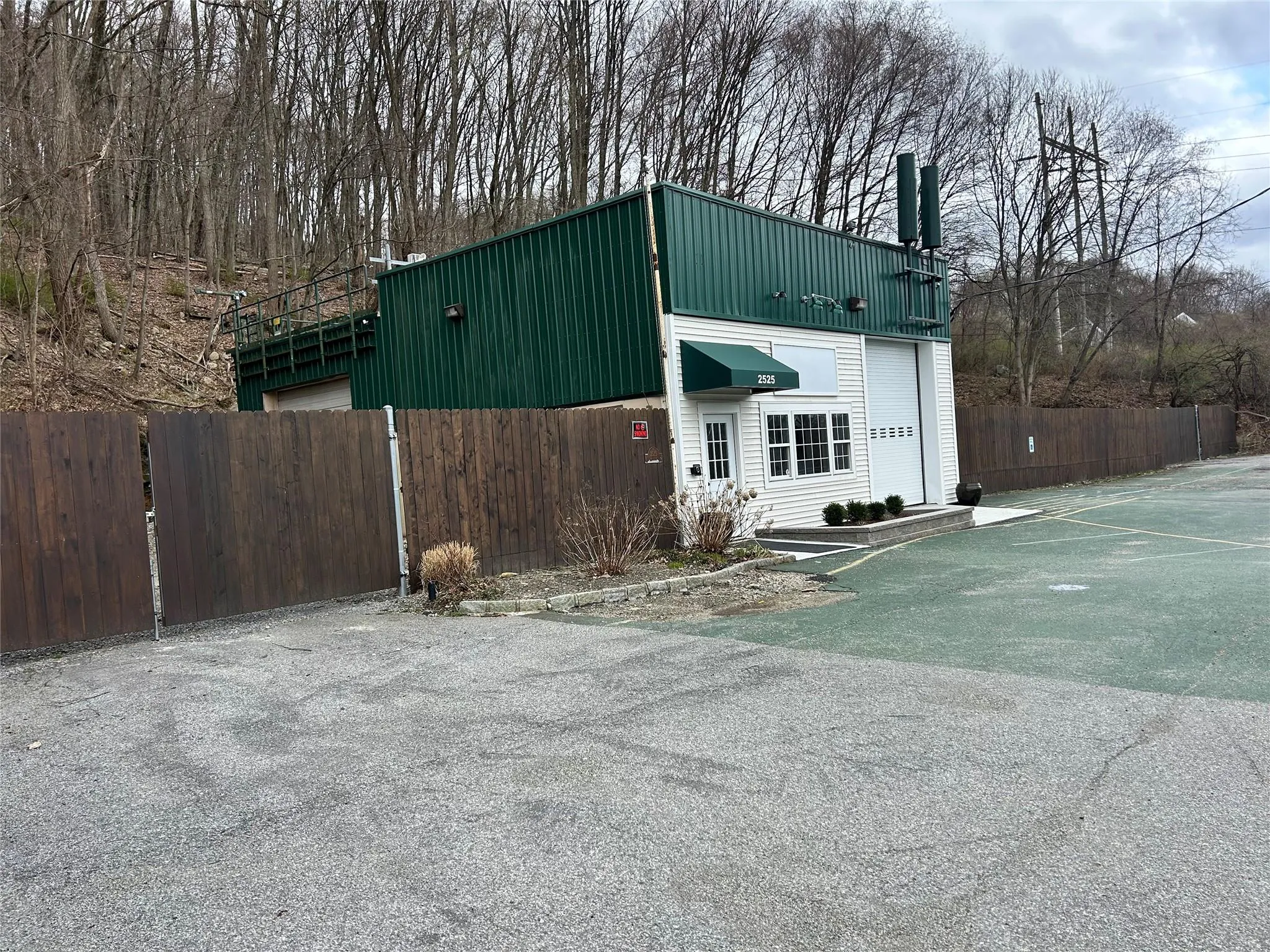 View of front of house featuring fence View of front of house featuring fence