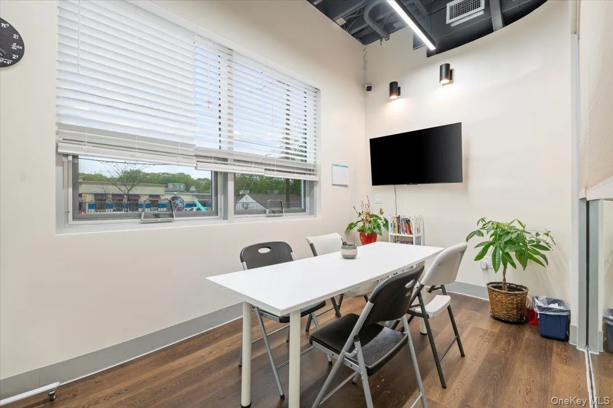 Office with dark wood-style floors and baseboards Office with dark wood-style floors and baseboards