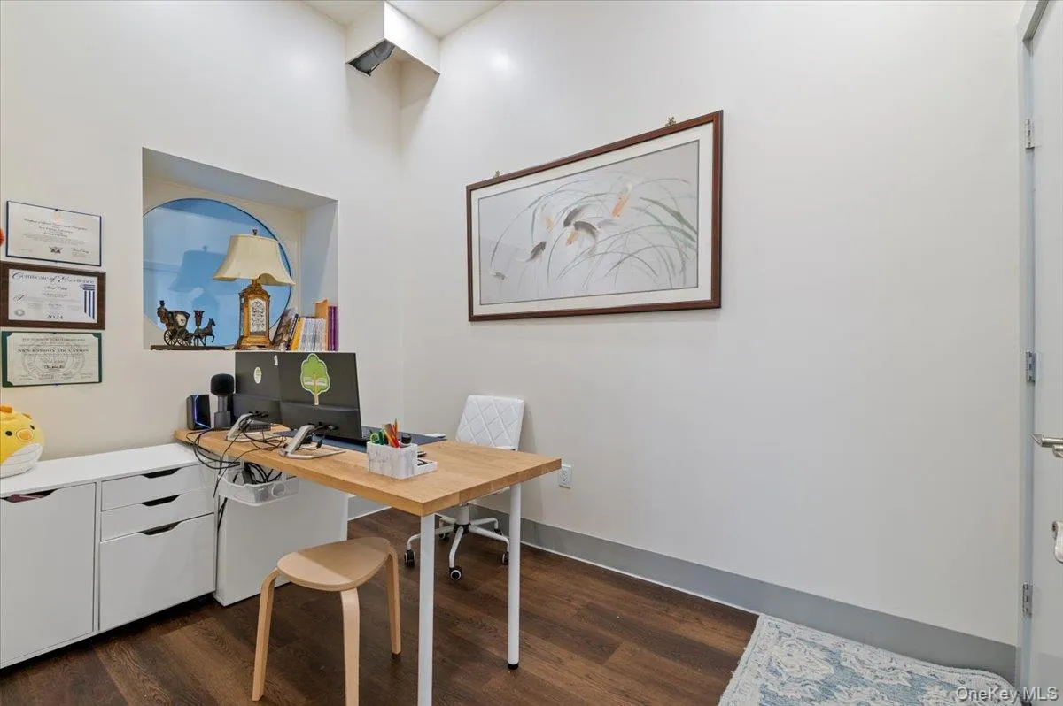 Office space with dark wood-style floors Office space with dark wood-style floors