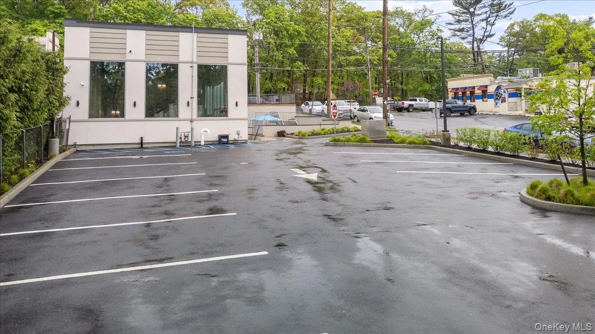 Uncovered parking lot with fence Uncovered parking lot with fence
