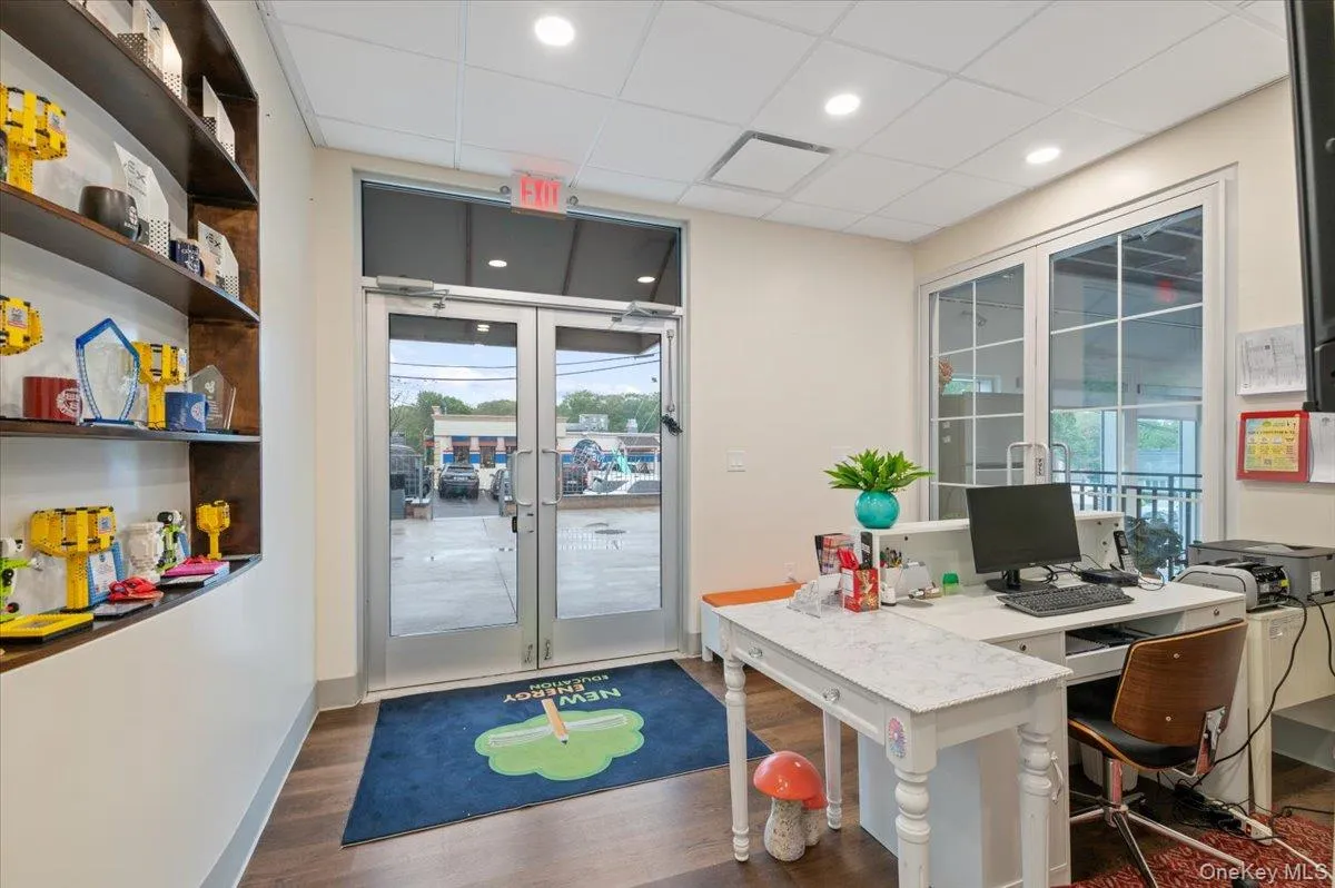 Home office featuring french doors, dark wood-style floors, healthy amount of natural light, a paneled ceiling, and recessed lighting Home office featuring french doors, dark wood-style floors, healthy amount of natural light, a paneled ceiling, and recessed lighting