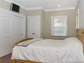 Bedroom with crown molding and recessed lighting Bedroom with crown molding and recessed lighting