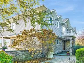 View of home's exterior featuring a balcony View of home's exterior featuring a balcony