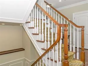 Stairs with ornamental molding and recessed lighting Stairs with ornamental molding and recessed lighting