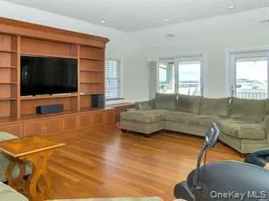 Living area with wood finished floors Living area with wood finished floors
