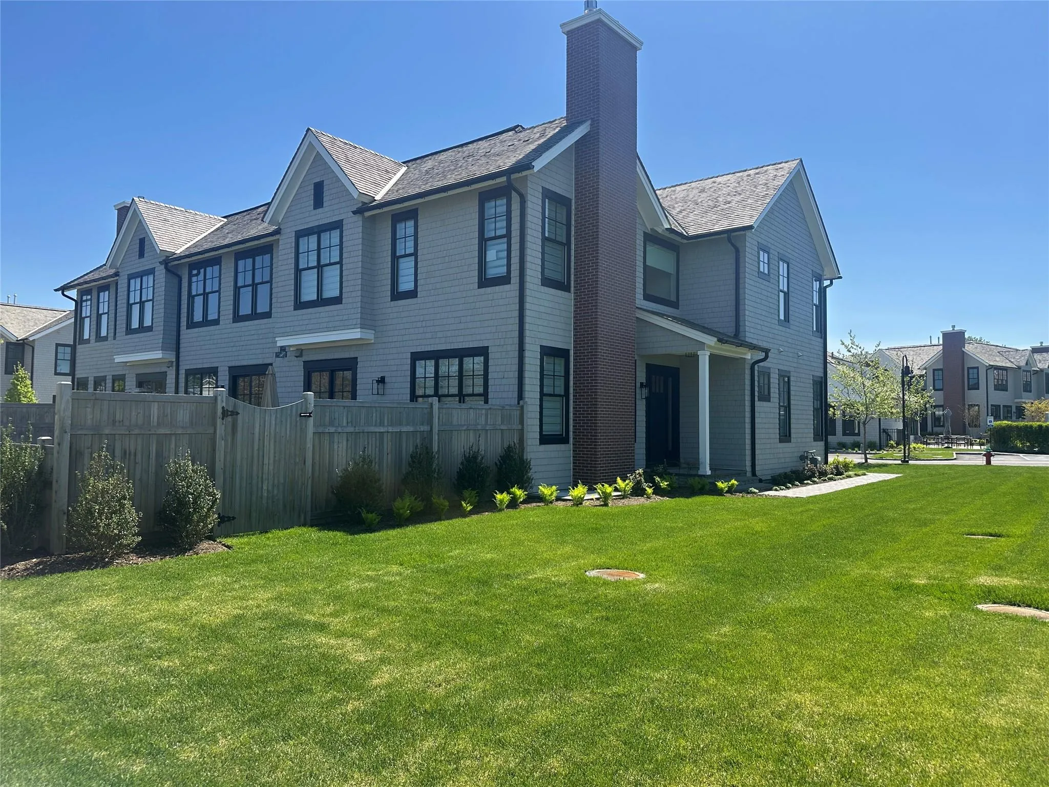 Back of property with a chimney and a residential view Back of property with a chimney and a residential view