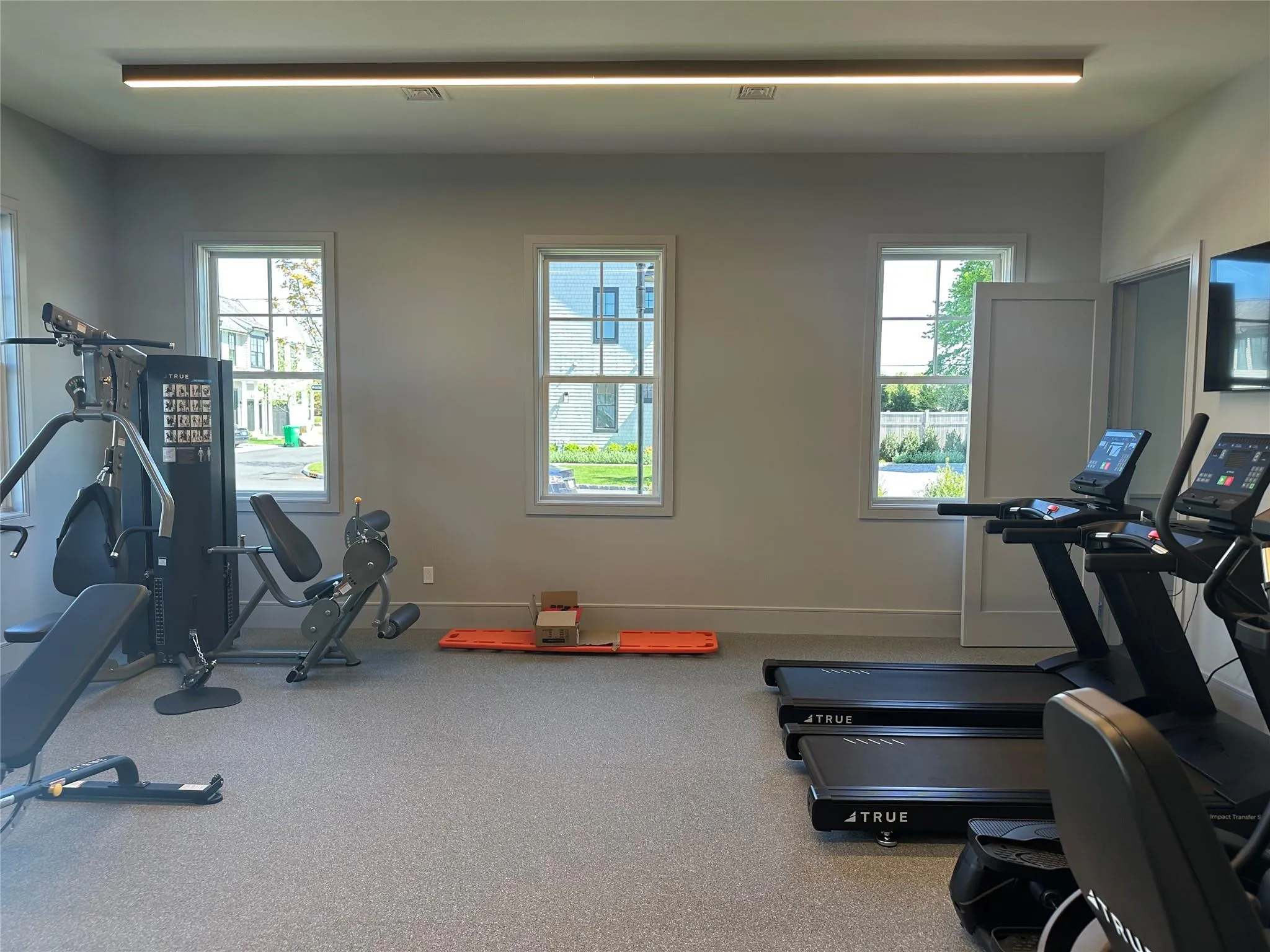 Workout area with healthy amount of natural light and baseboards Workout area with healthy amount of natural light and baseboards