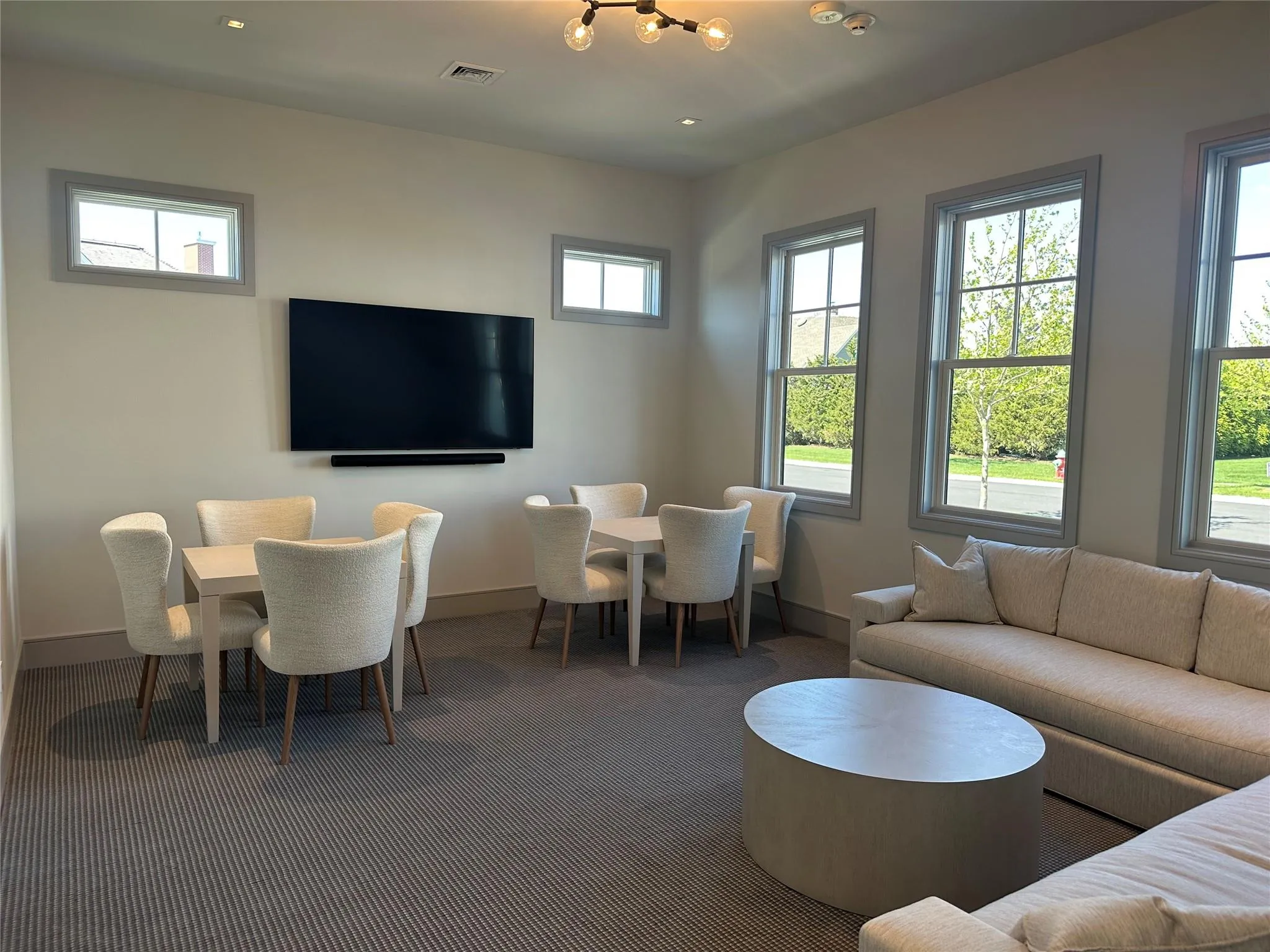 Carpeted living area with baseboards and recessed lighting Carpeted living area with baseboards and recessed lighting