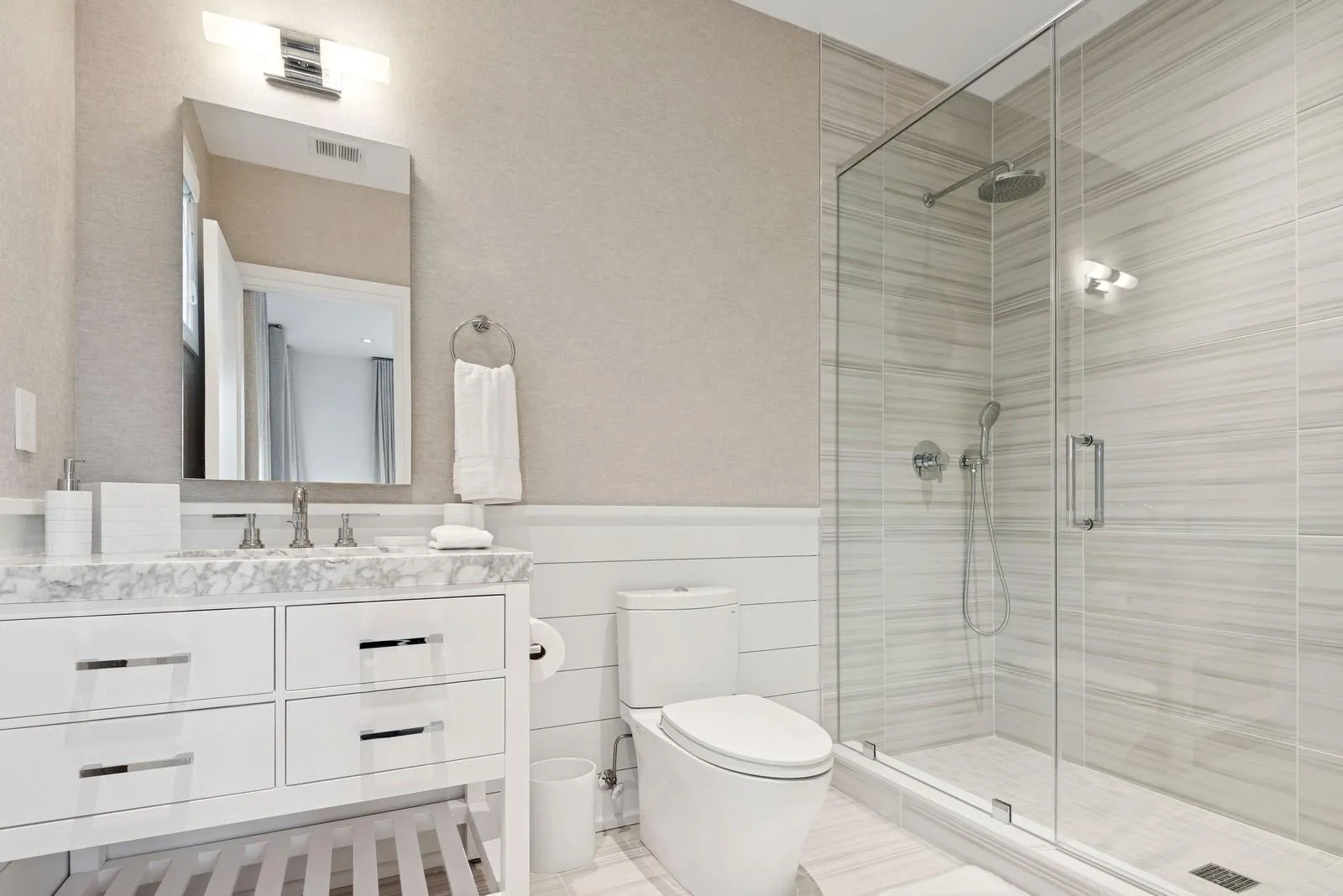 Bathroom with a shower stall, toilet, and vanity Bathroom with a shower stall, toilet, and vanity
