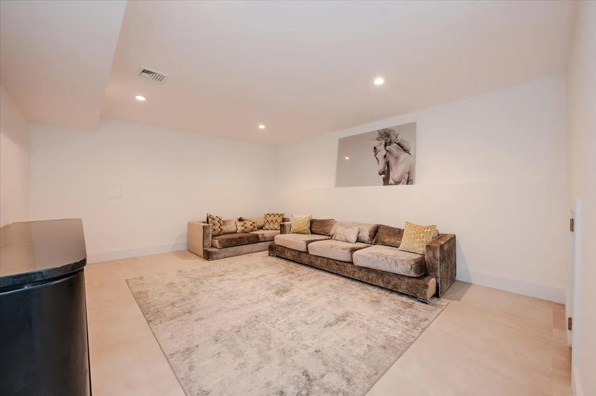 Living room with recessed lighting and baseboards Living room with recessed lighting and baseboards