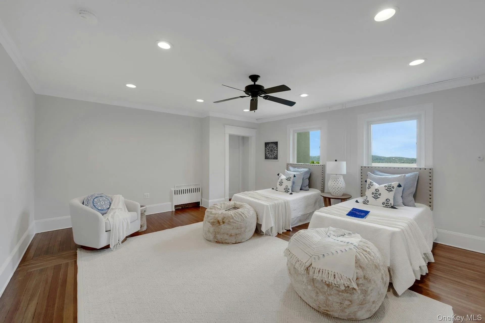 Bedroom with crown molding, recessed lighting, and wood finished floors and River views. Bedroom with crown molding, recessed lighting, and wood finished floors and River views.
