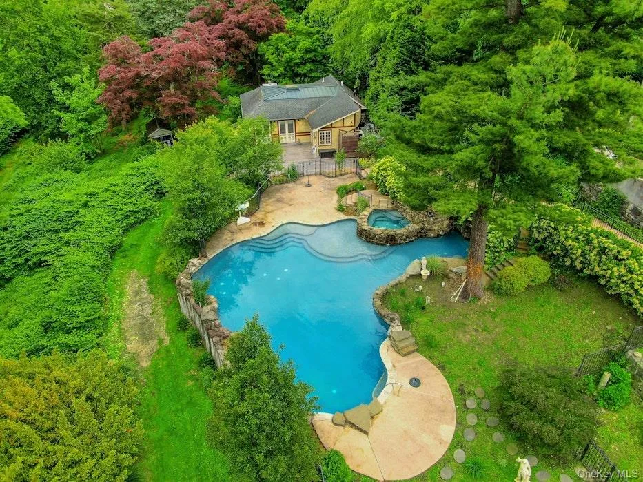 Aerial view of pool, pool house and surrounding gardens Aerial view of pool, pool house and surrounding gardens