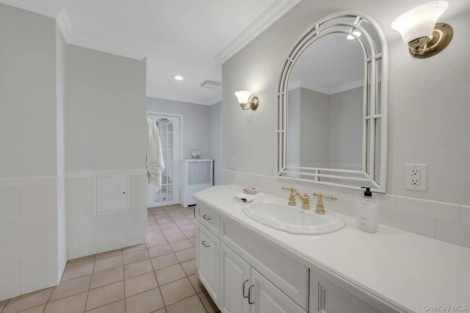 Upstairs hall bathroom with vanity, crown molding, tile patterned floors, and recessed lighting Upstairs hall bathroom with vanity, crown molding, tile patterned floors, and recessed lighting