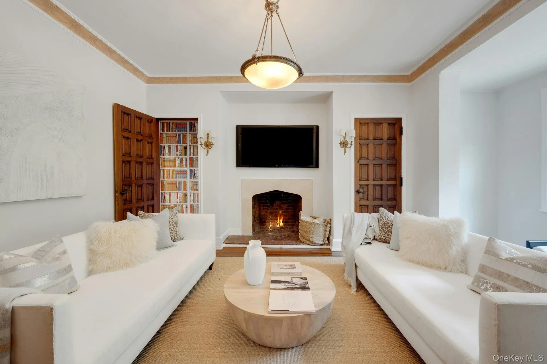 Relaxing room featuring a warm lit fireplace Relaxing room featuring a warm lit fireplace