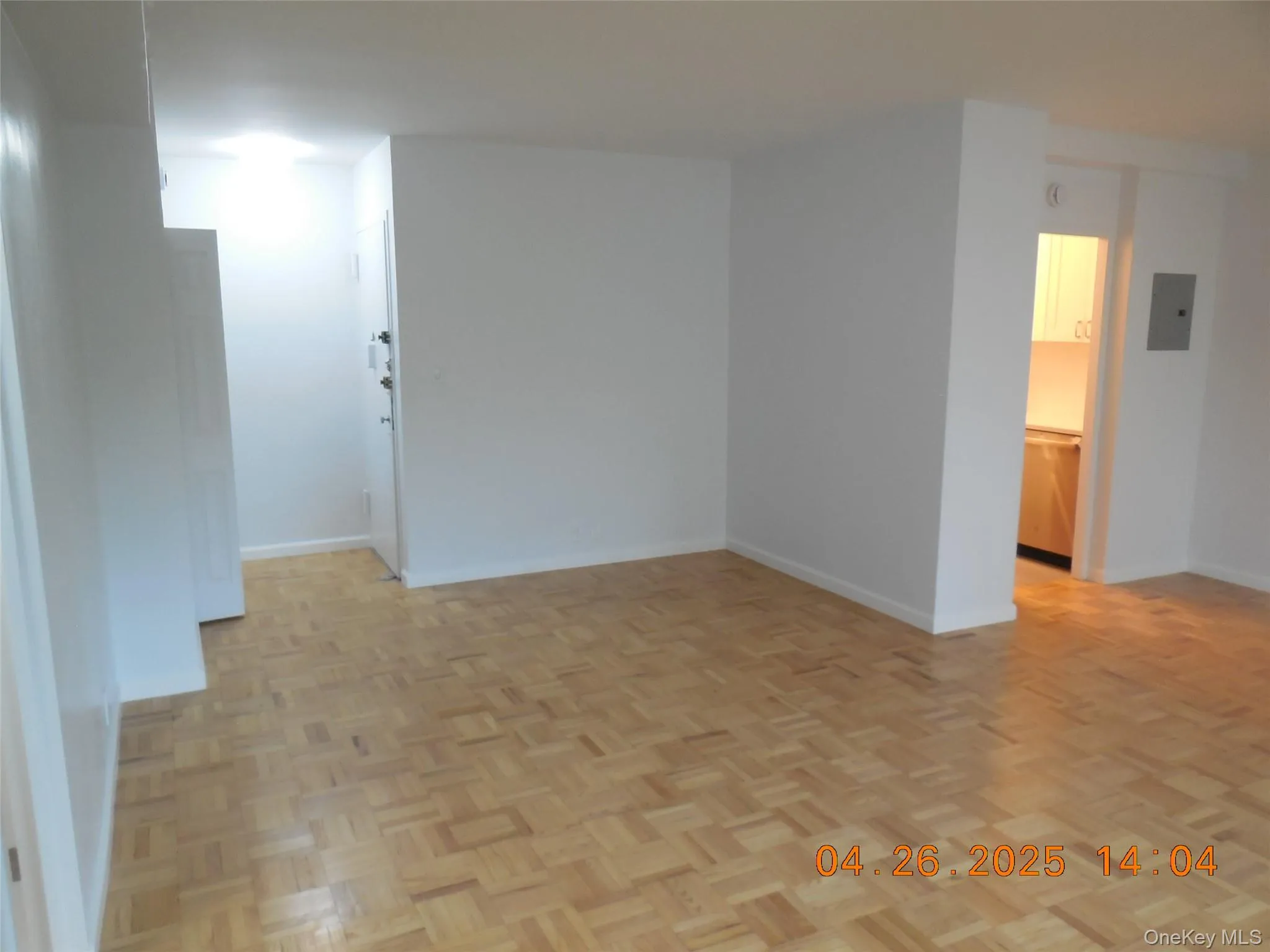 Spare room with electric panel and baseboards Spare room with electric panel and baseboards