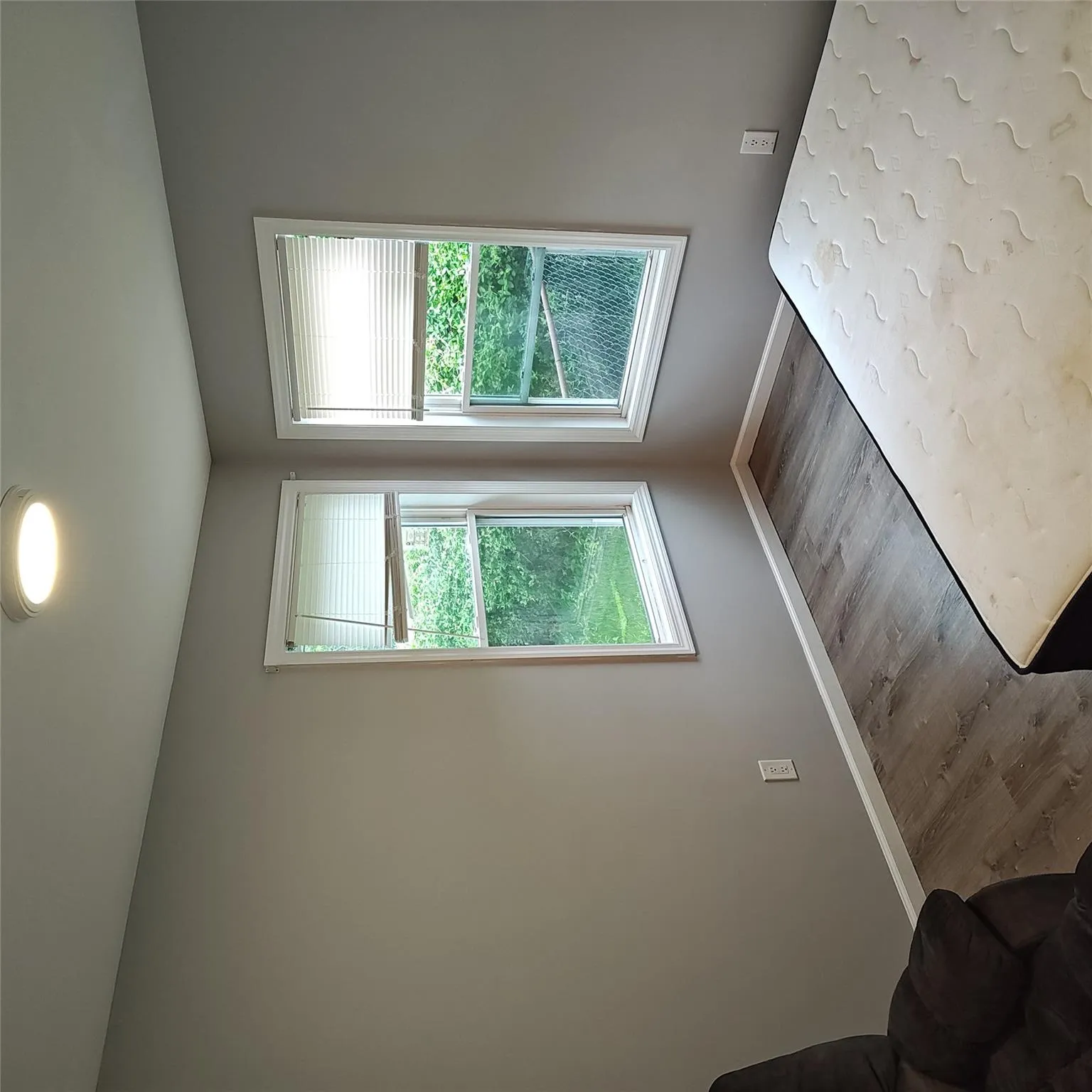 Unfurnished bedroom featuring wood finished floors and baseboards Unfurnished bedroom featuring wood finished floors and baseboards