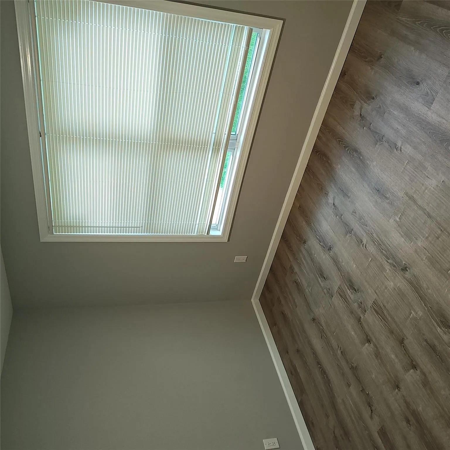 Spare room featuring baseboards and wood finished floors Spare room featuring baseboards and wood finished floors