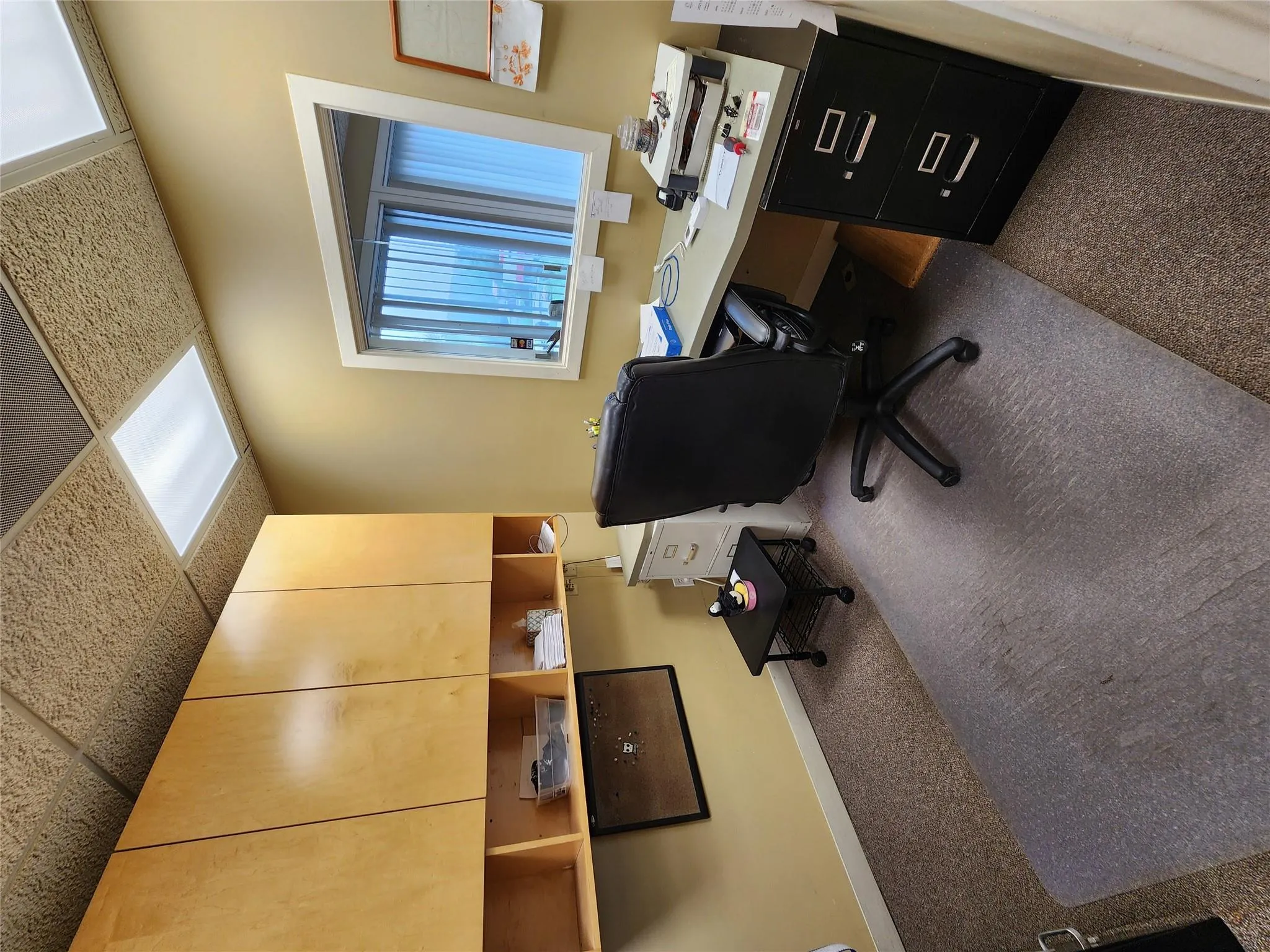 Carpeted office space featuring baseboards Carpeted office space featuring baseboards