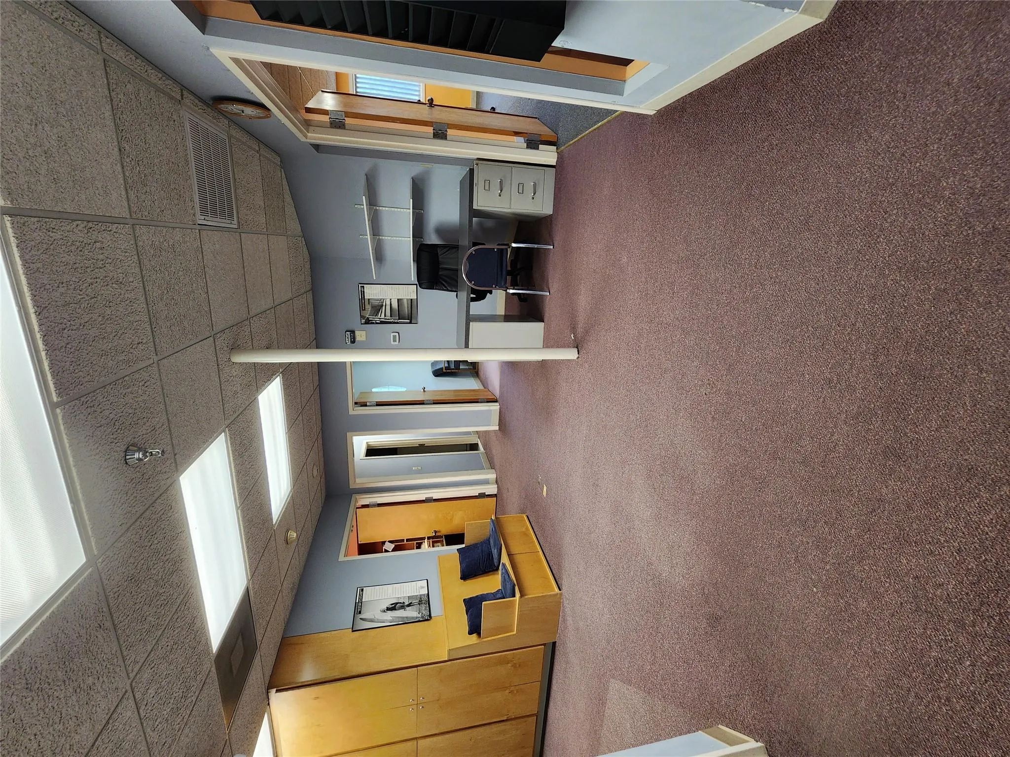 Carpeted home office featuring a drop ceiling Carpeted home office featuring a drop ceiling