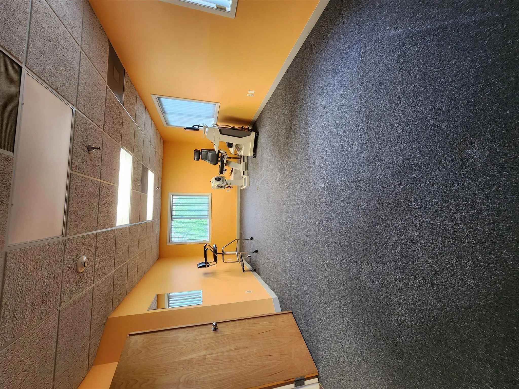 Workout room featuring a drop ceiling and baseboards Workout room featuring a drop ceiling and baseboards