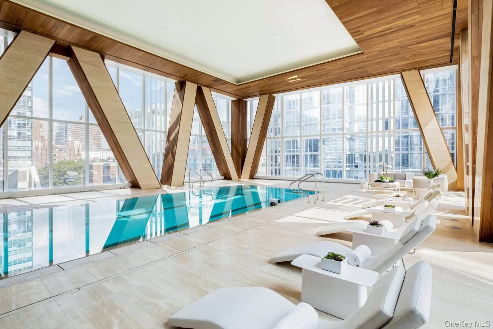 Indoor community pool with a view of city Indoor community pool with a view of city