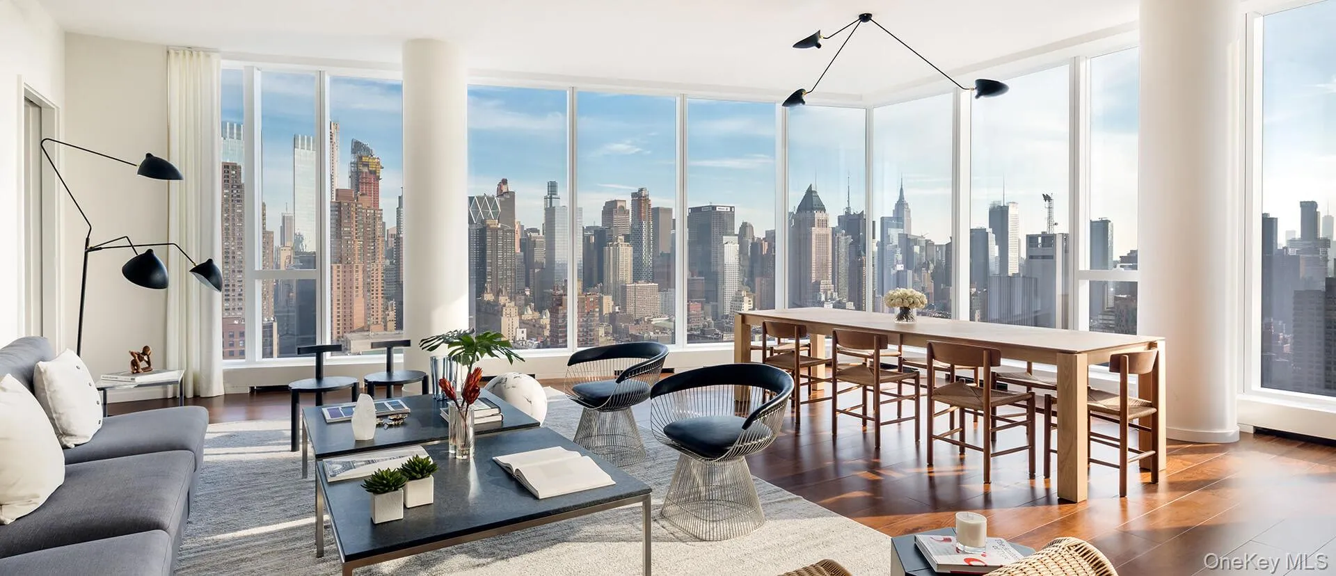 Living area with wood finished floors and a skyline view Living area with wood finished floors and a skyline view