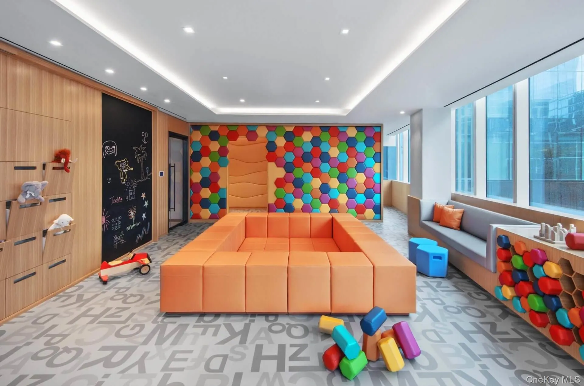 Rec room with recessed lighting, light colored carpet, and a raised ceiling Rec room with recessed lighting, light colored carpet, and a raised ceiling