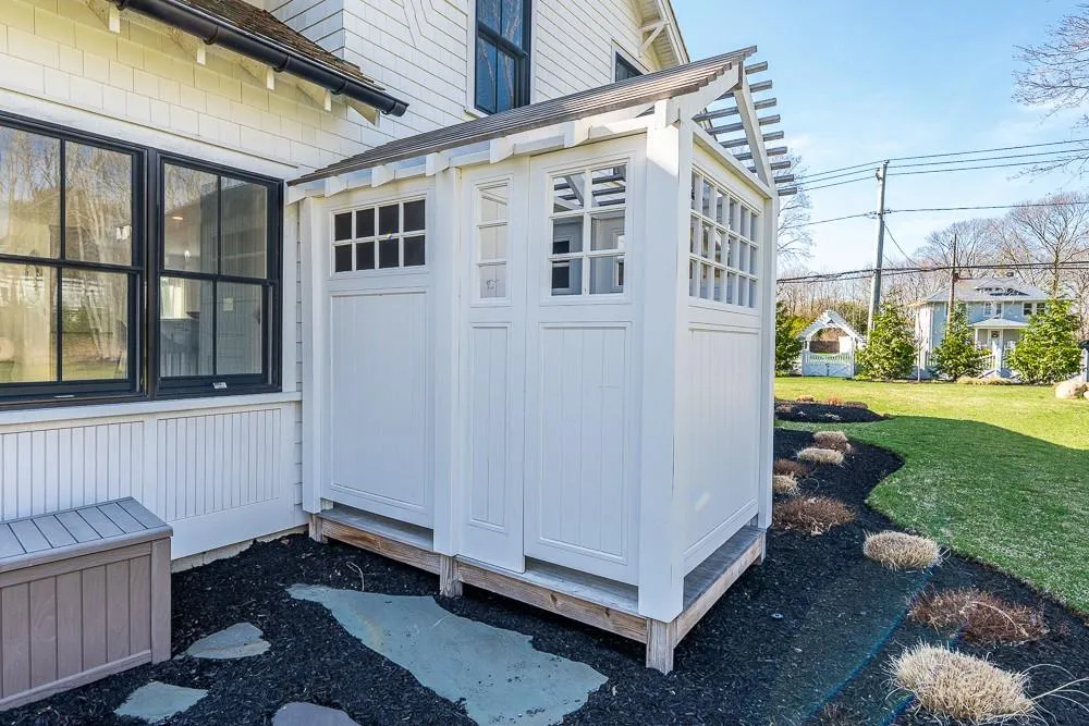View of exterior entry featuring a yard View of exterior entry featuring a yard