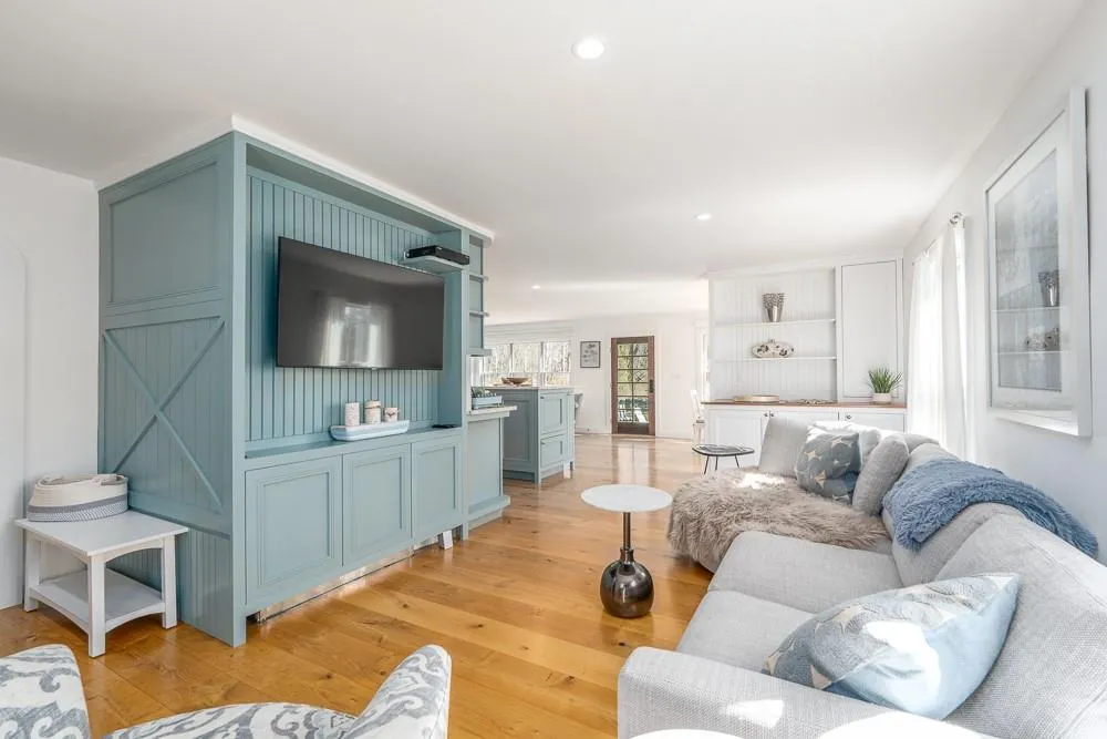 Living area featuring light wood-style flooring and recessed lighting Living area featuring light wood-style flooring and recessed lighting