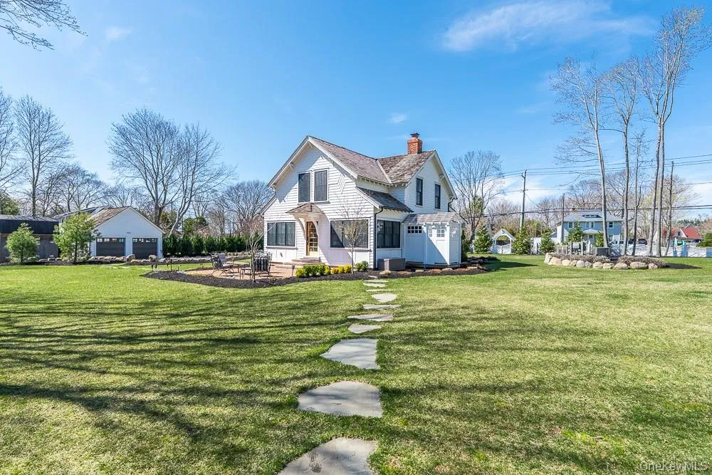 View of front of home with a chimney and a front lawn View of front of home with a chimney and a front lawn
