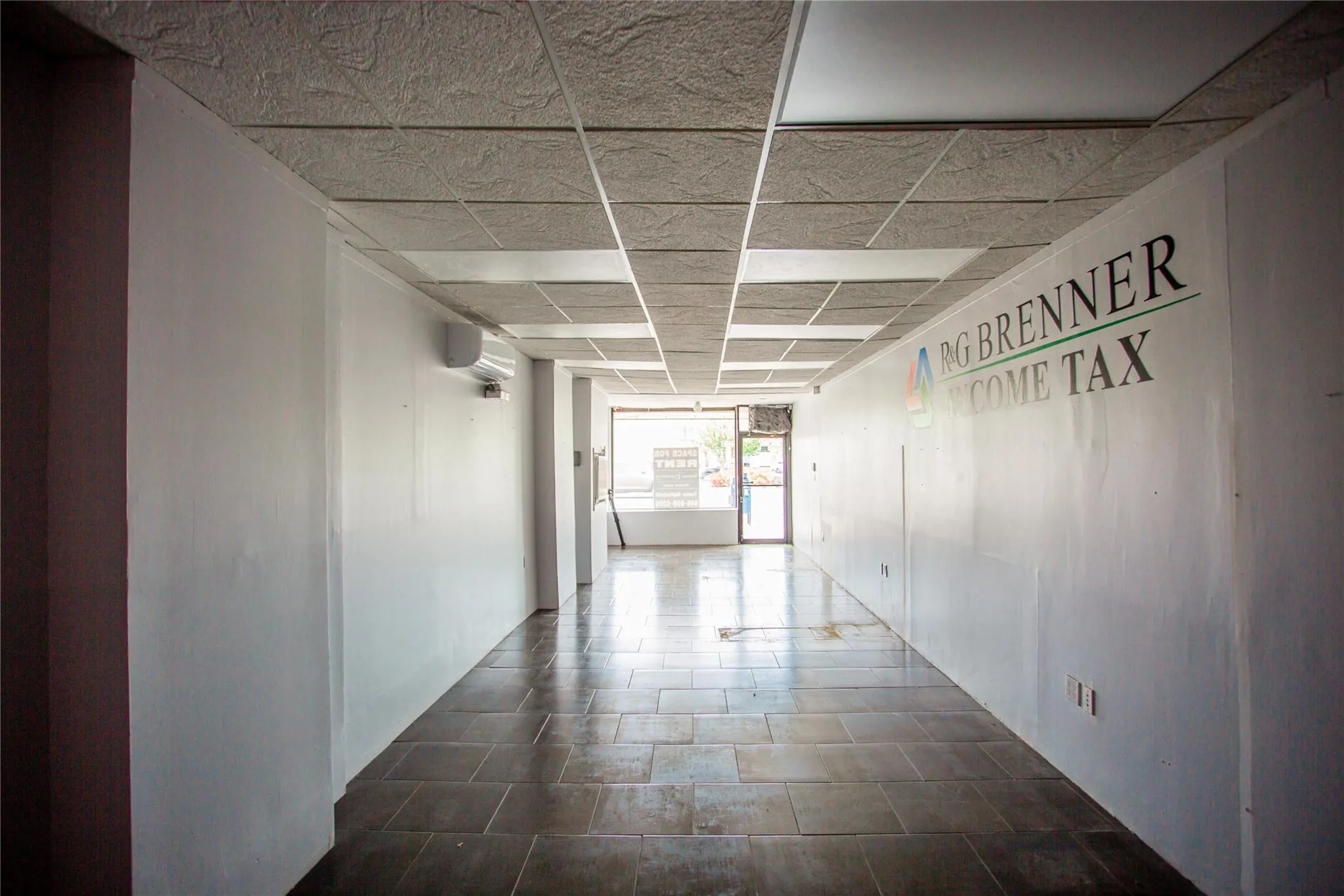 Hallway featuring an AC wall unit Hallway featuring an AC wall unit