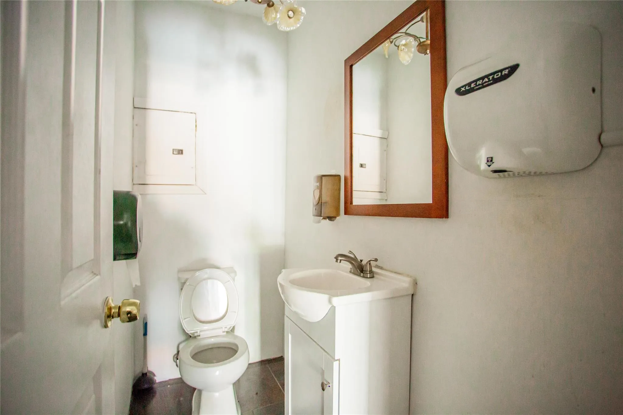 Bathroom featuring vanity and water heater Bathroom featuring vanity and water heater