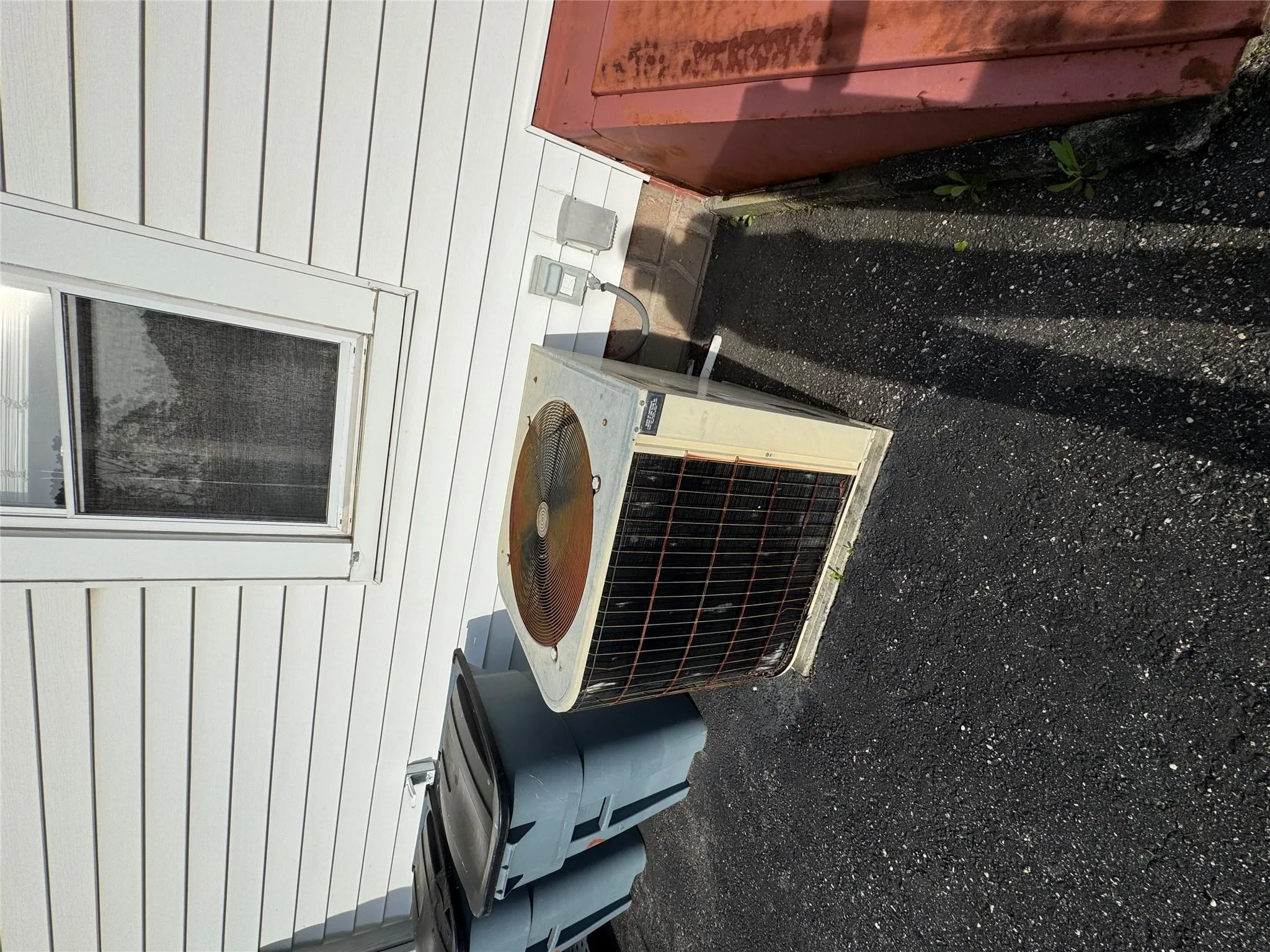 Exterior view of central AC unit and a bulkhead entry Exterior view of central AC unit and a bulkhead entry